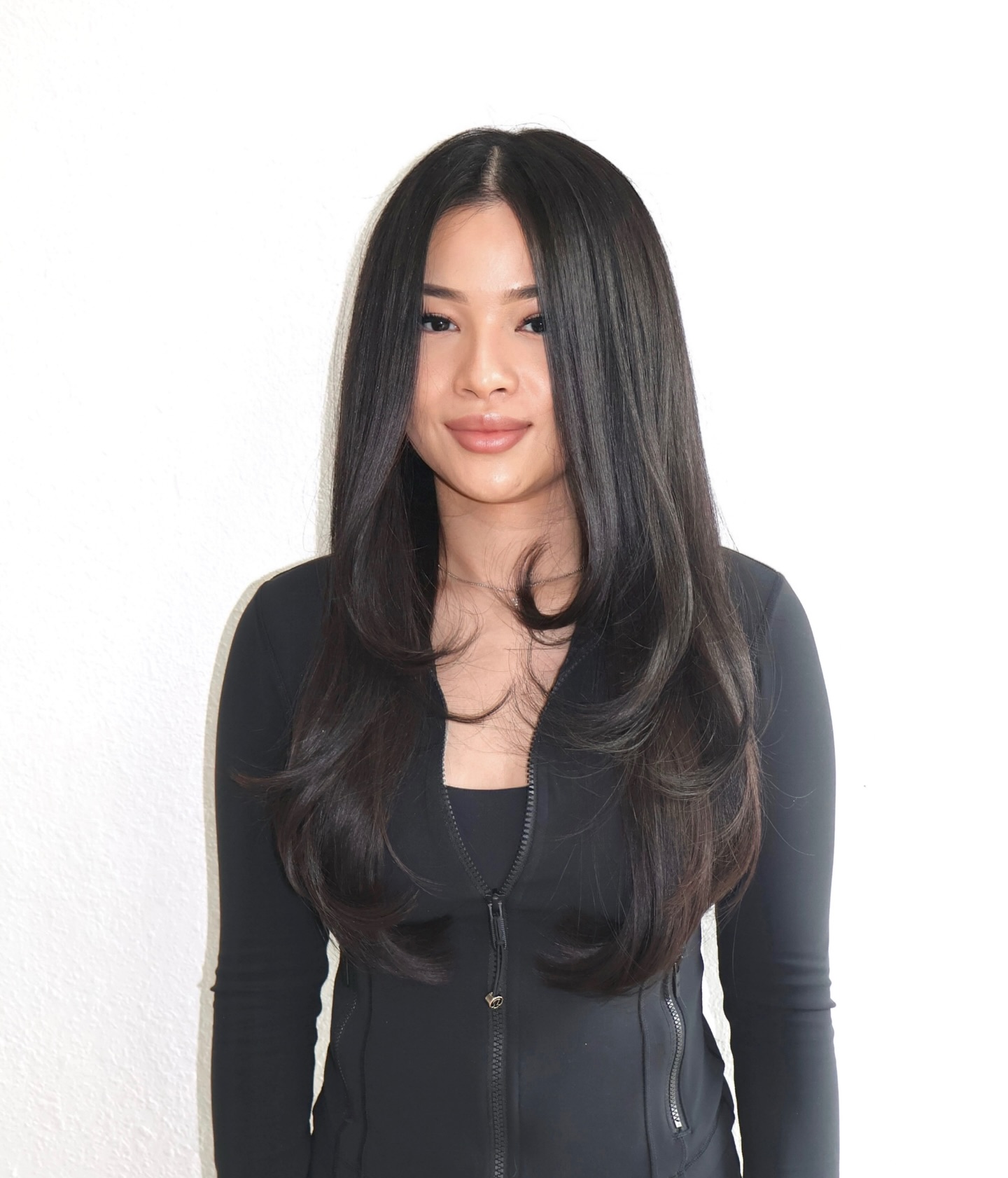 Sleek Long Layered Cut with Soft Face-Framing Layers