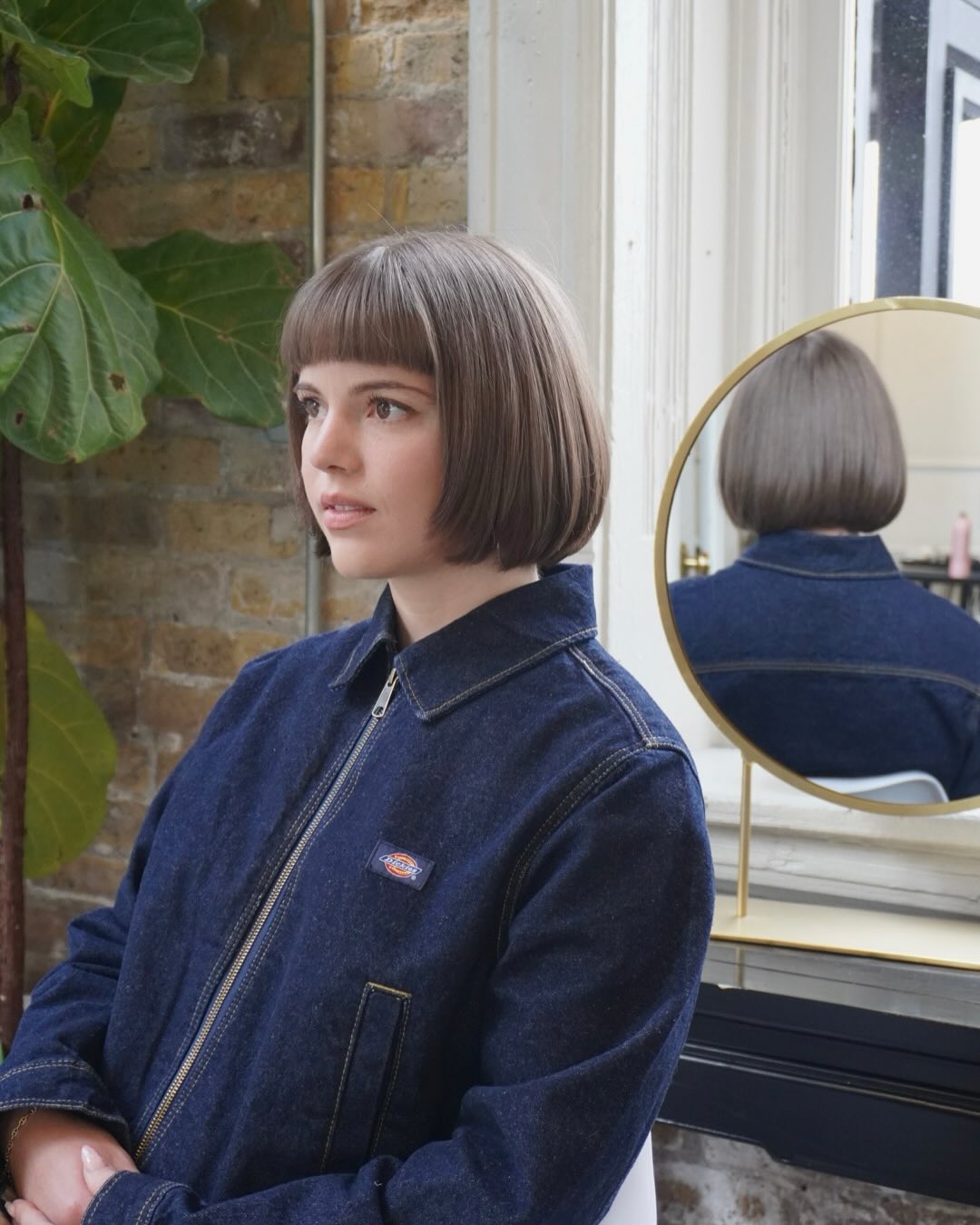 Sleek Rounded Bob with Bold Bangs