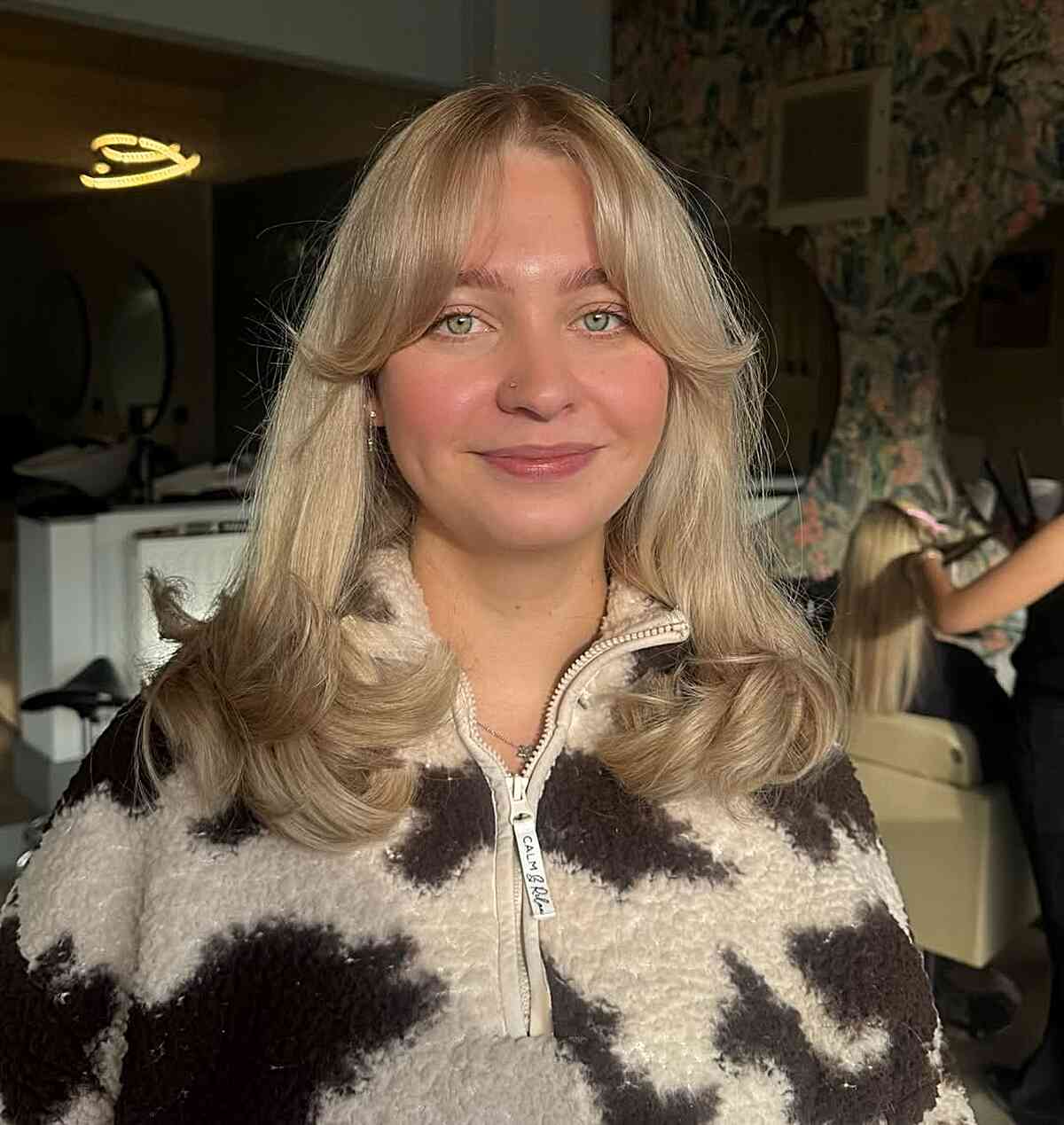Stylish Blonde Layers with Curtain Bangs