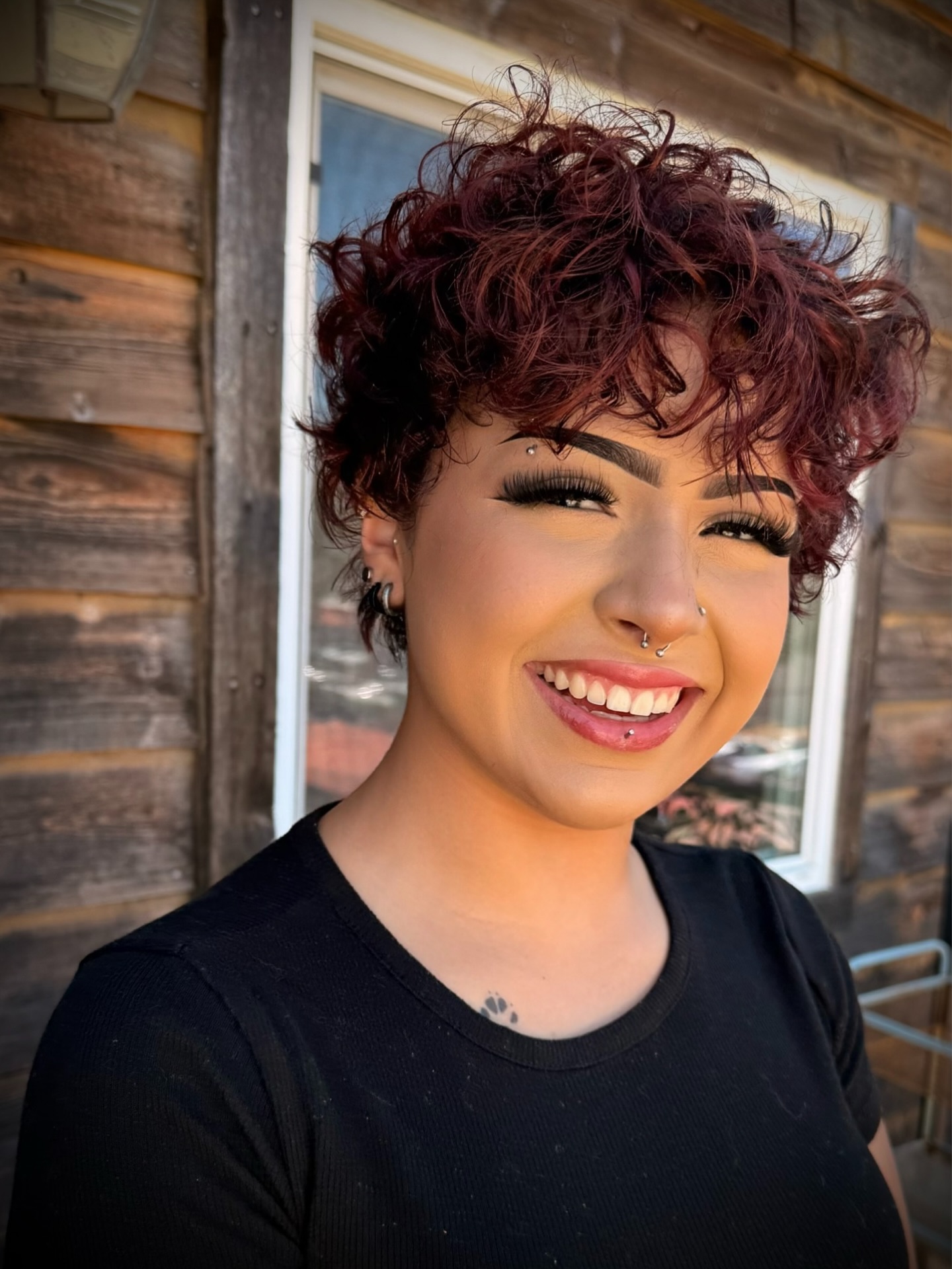 Textured Curly Pixie with Rich Red Tones