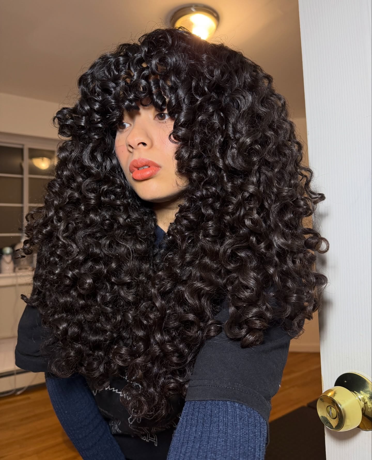 Bold Layered Curls with Defined Volume