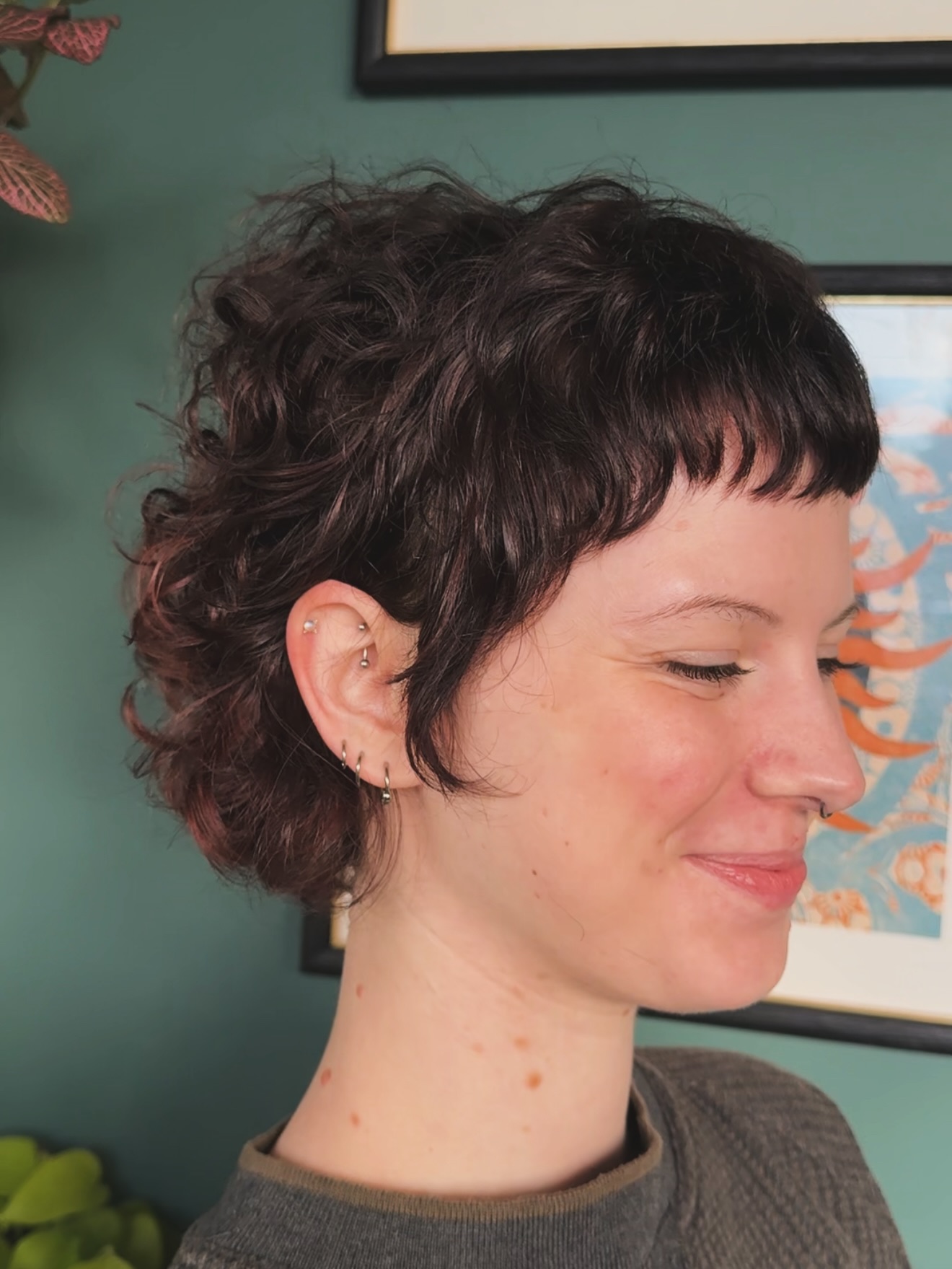 Chic Curly Pixie Shag Haircut with Textured Bangs