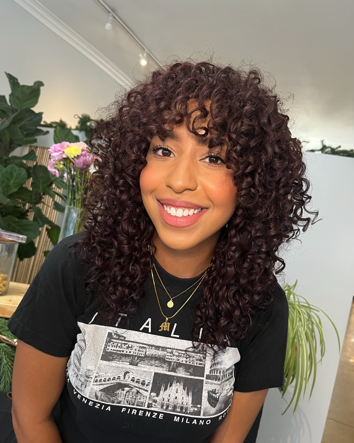 Layered Curly Cut with Soft Bangs