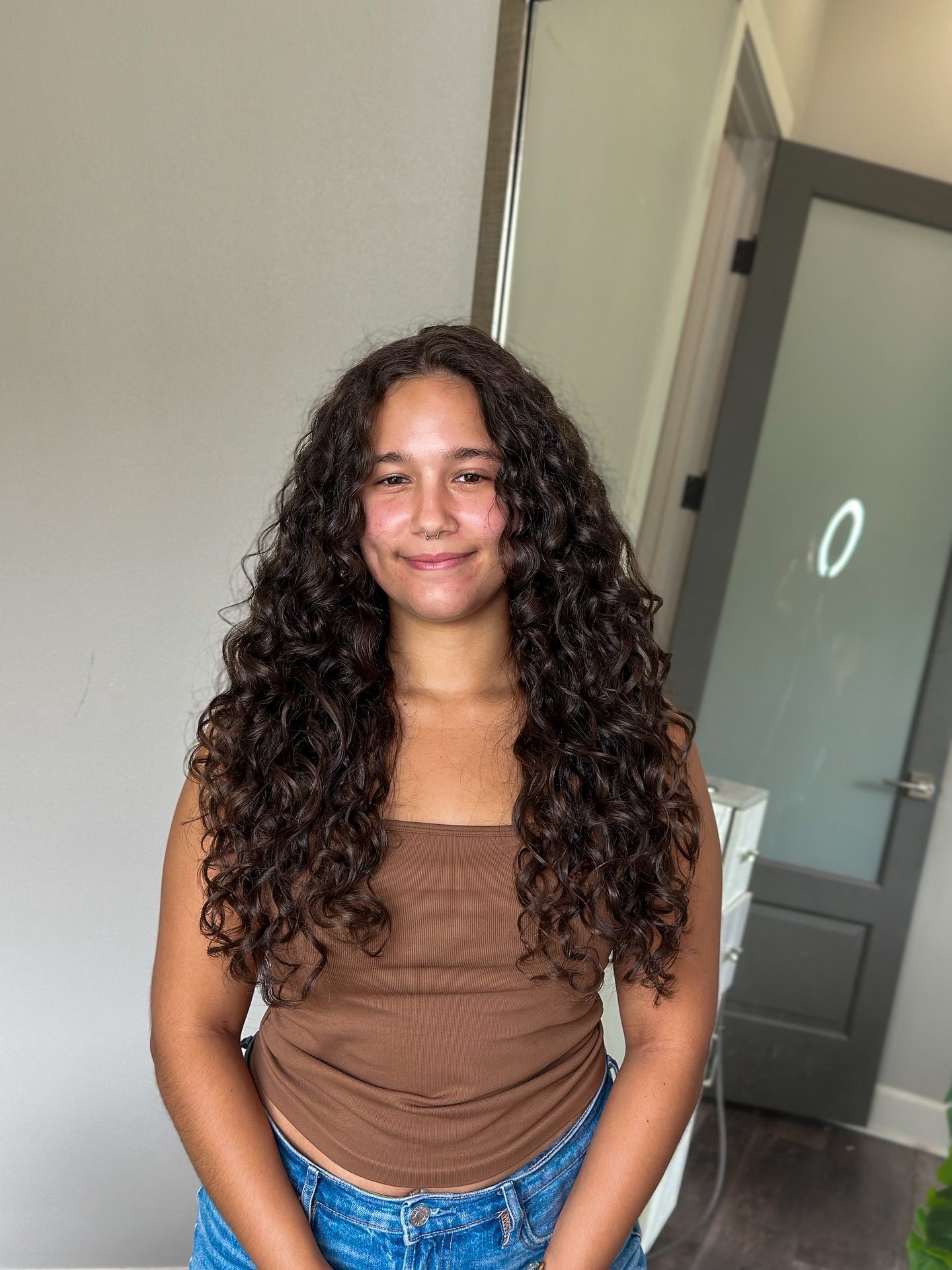Layered Curly Cut with Soft Face-Framing Curls