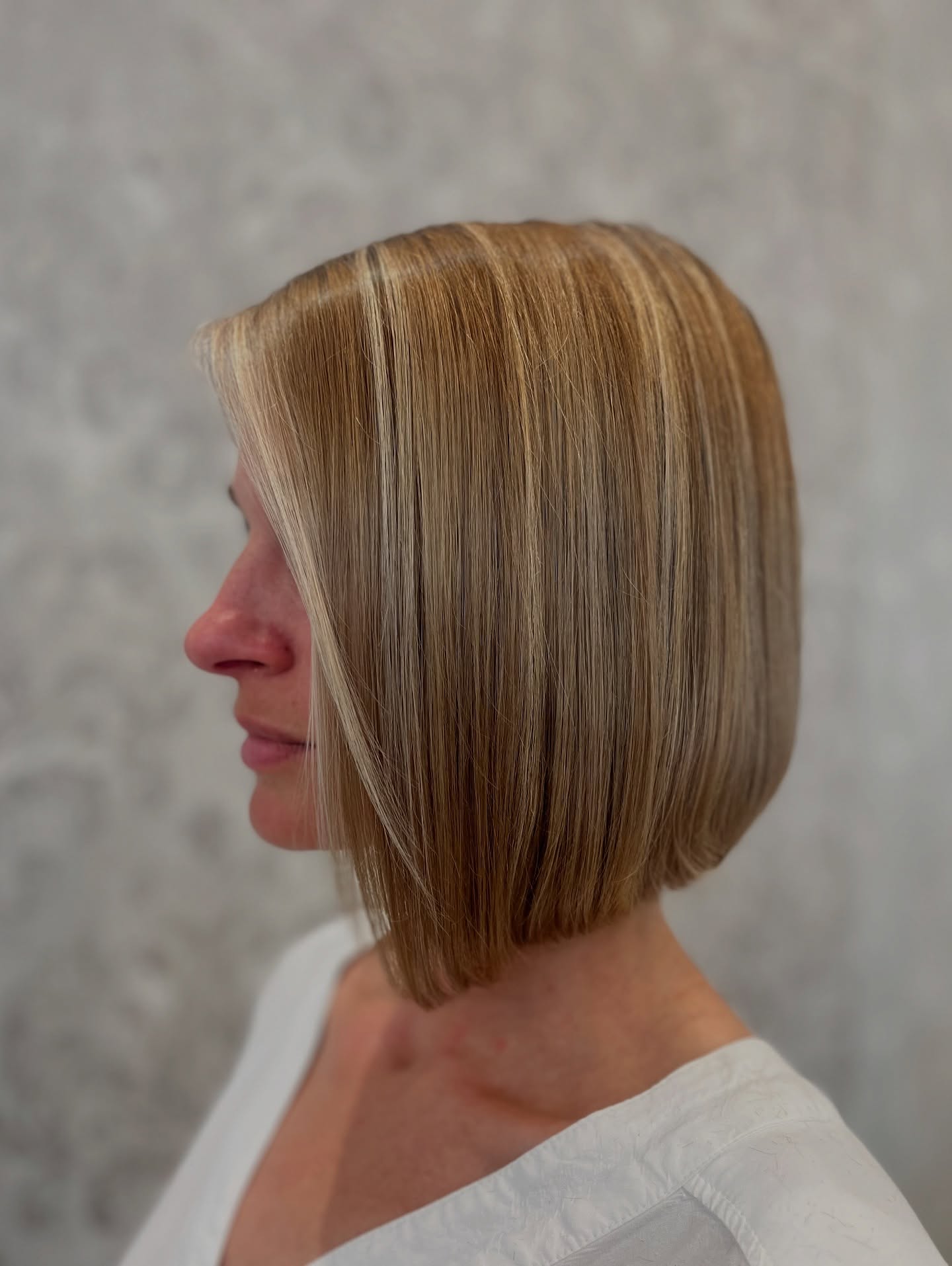 Polished Angled Bob with Bright Blonde Highlights