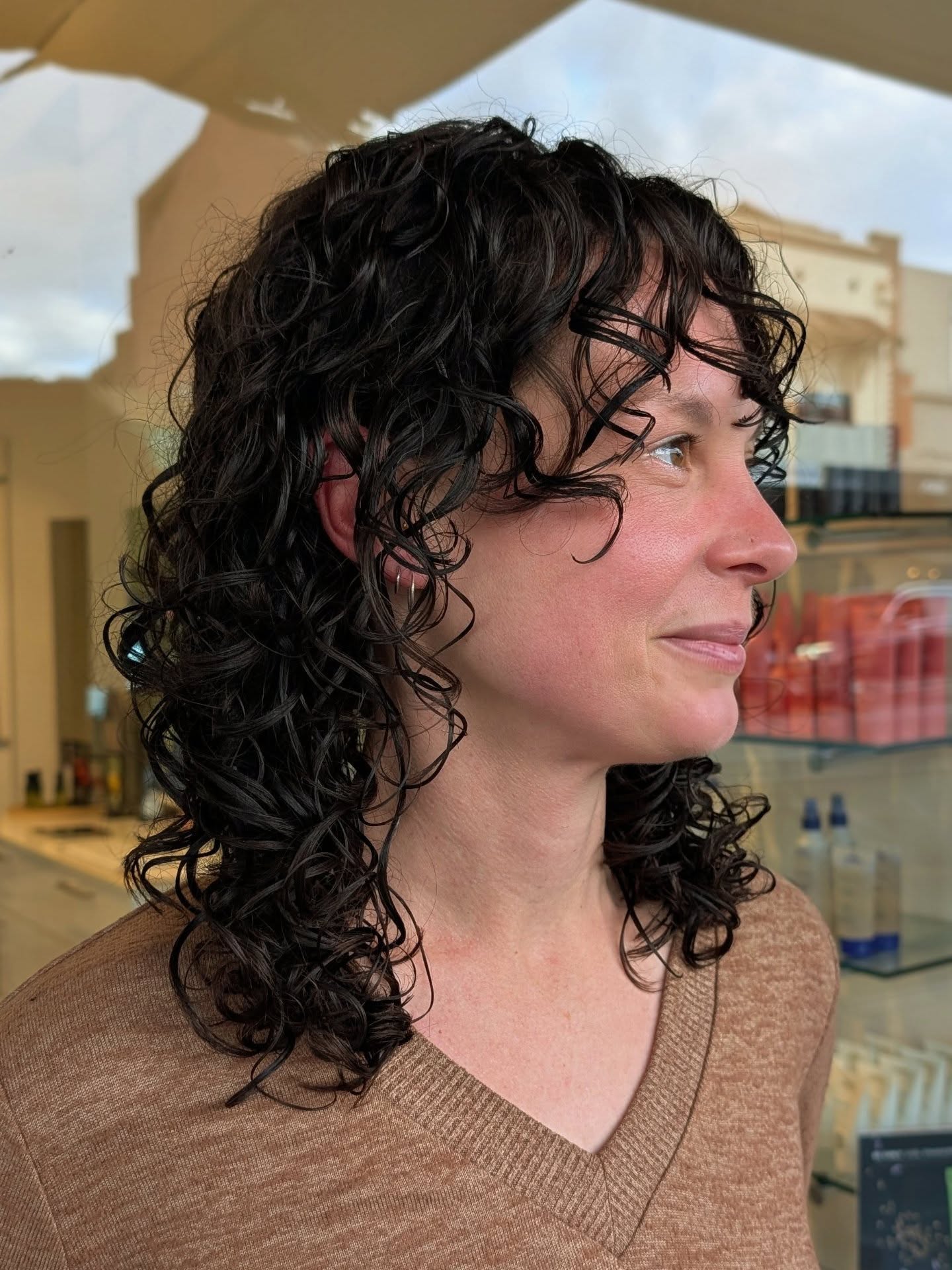 Textured Curly Layers with Soft Bangs
