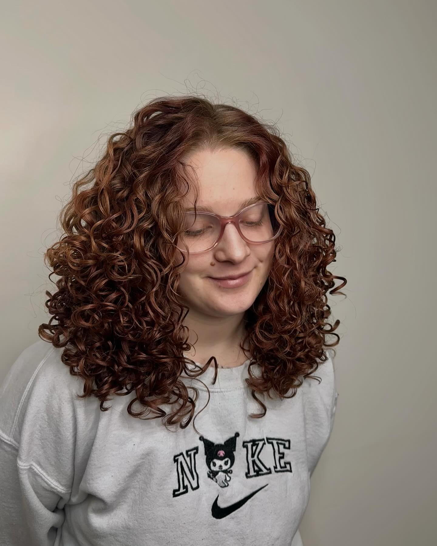 Textured Curly Layers with Vibrant Copper Tones