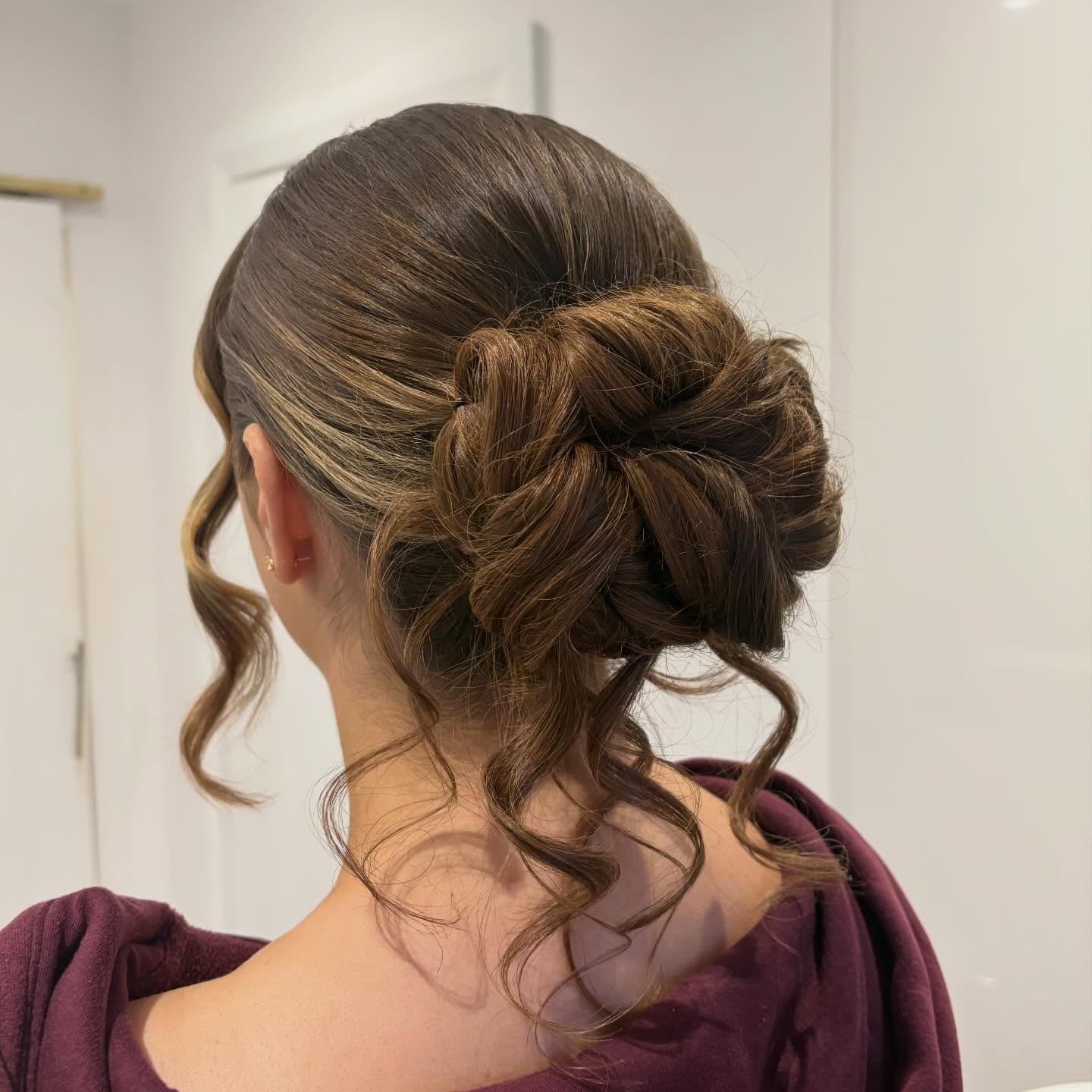 Chic Twisted Low Bun with Soft Curls