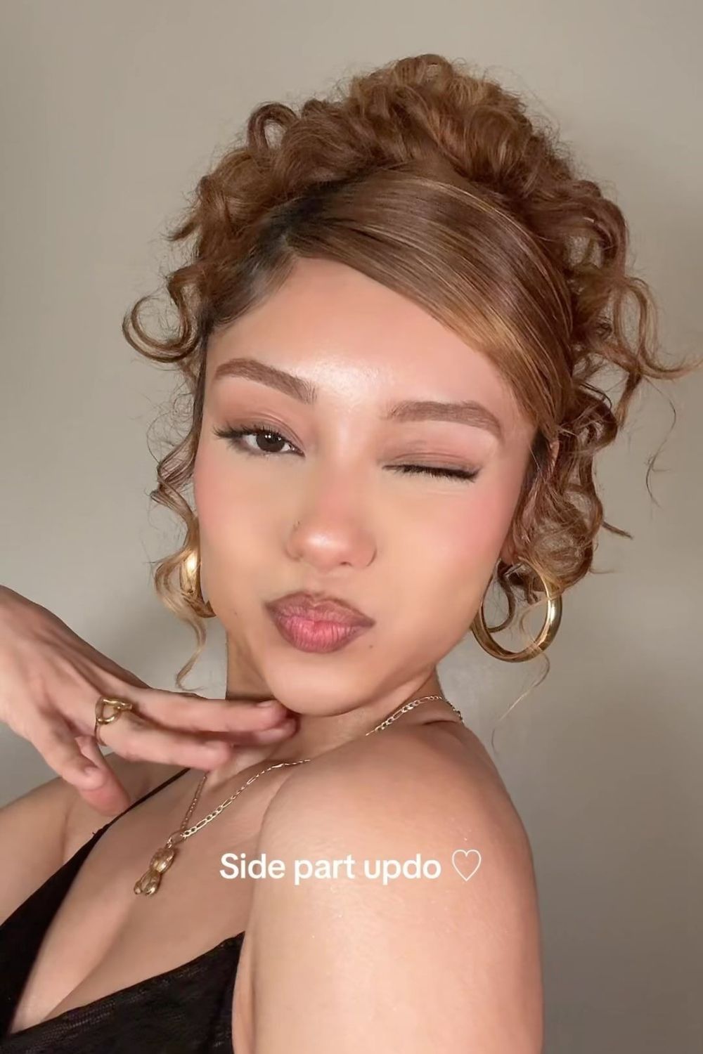 Chic Curly Side Part Updo with Playful Tendrils