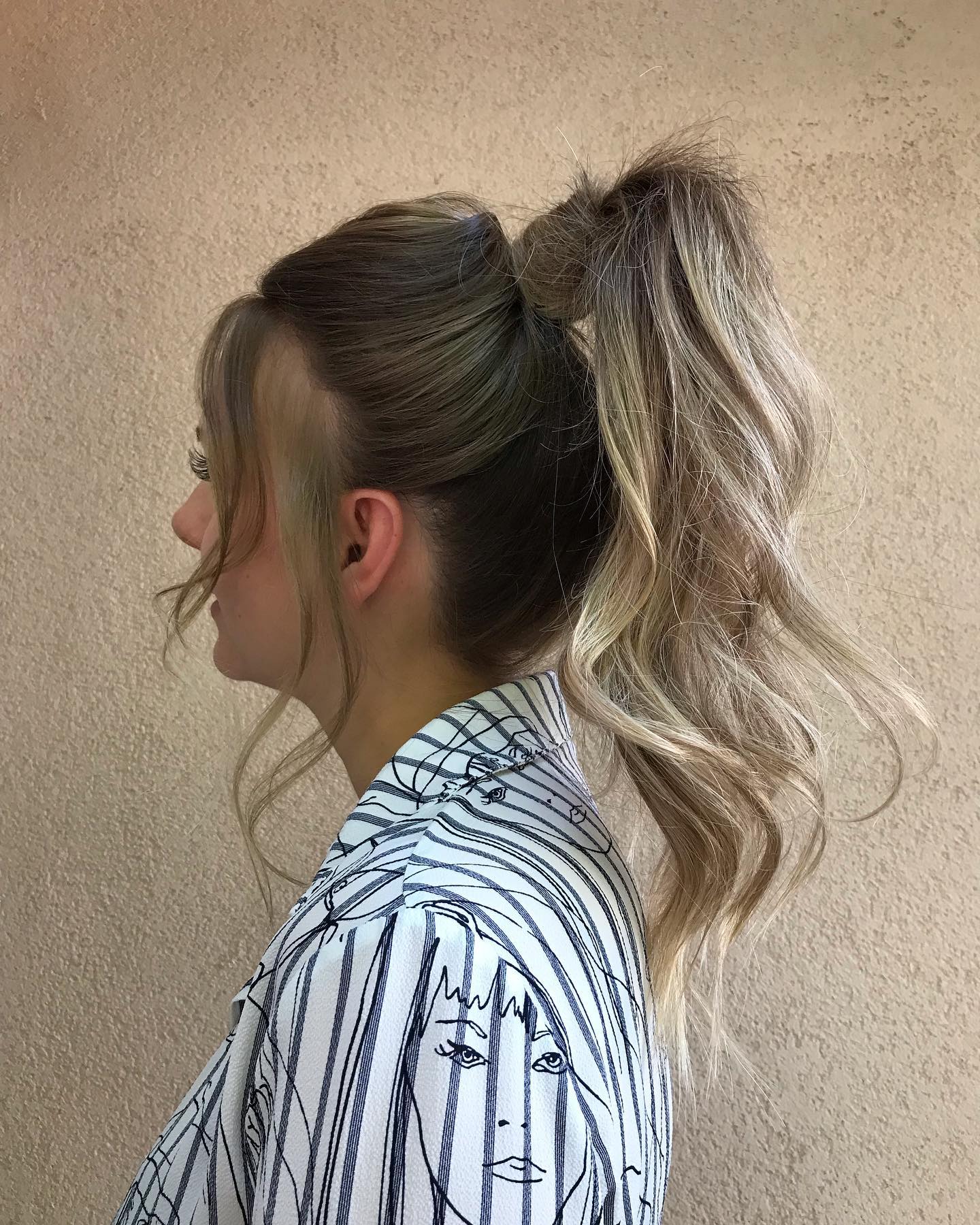 Chic High Textured Ponytail with Loose Waves