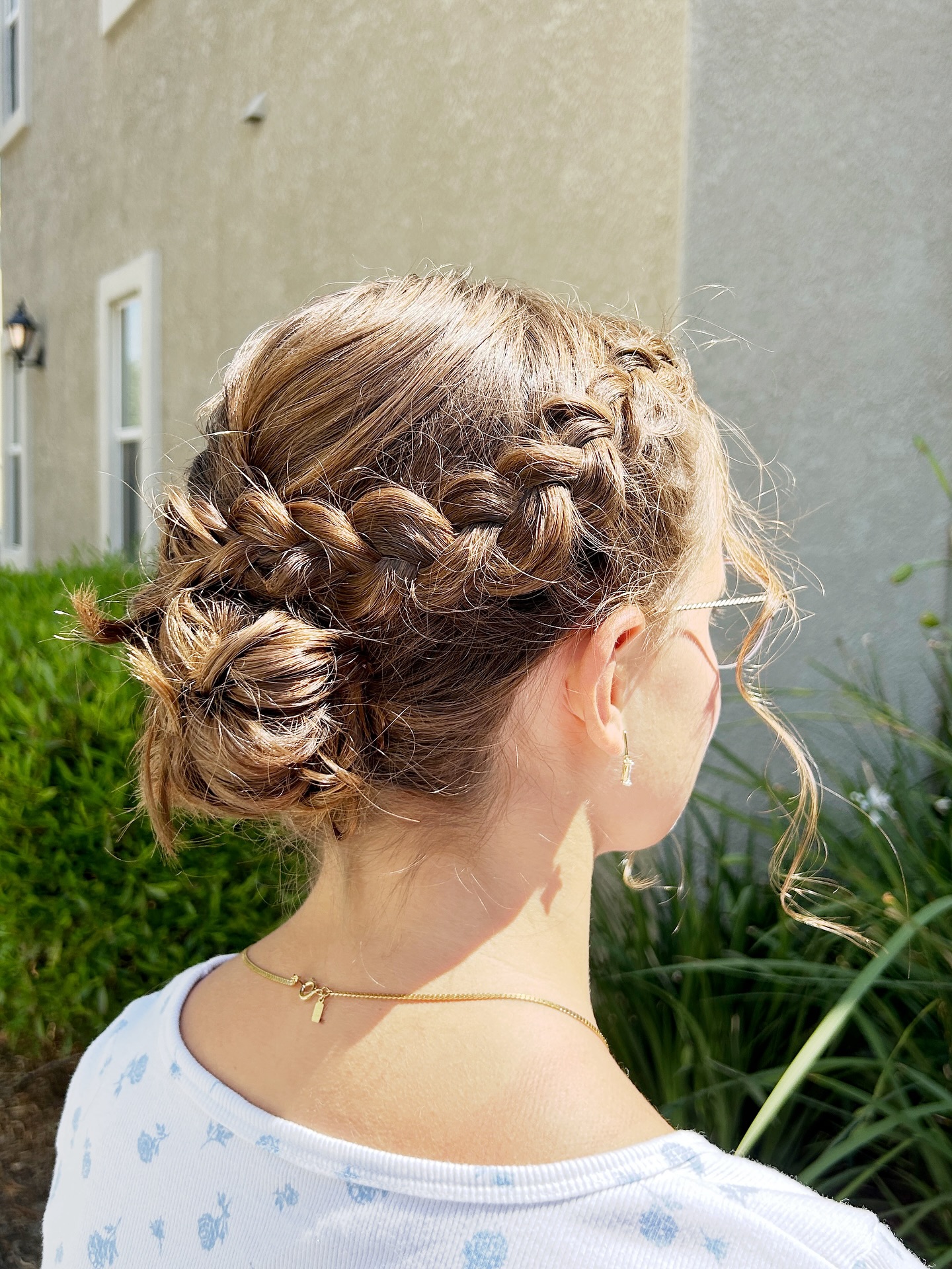 Intricate Braided Crown with Textured Low Bun