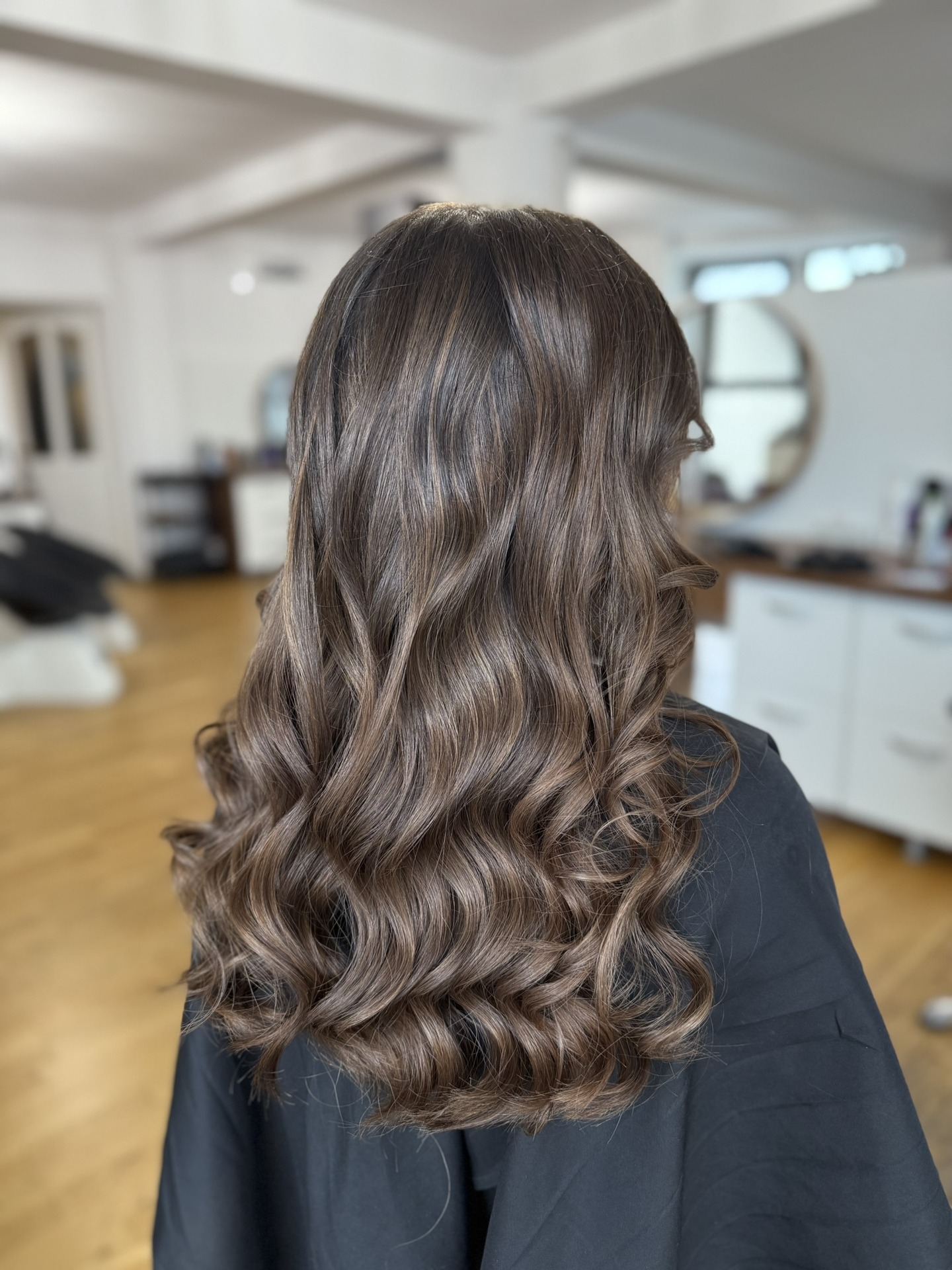 Luxurious Warm Chocolate Balayage with Defined Curls