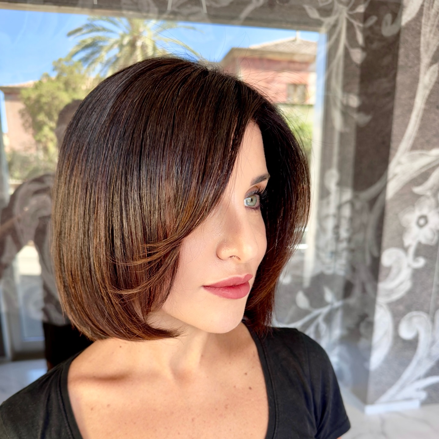 Sleek Glossy A-Line Bob with Subtle Caramel Highlights