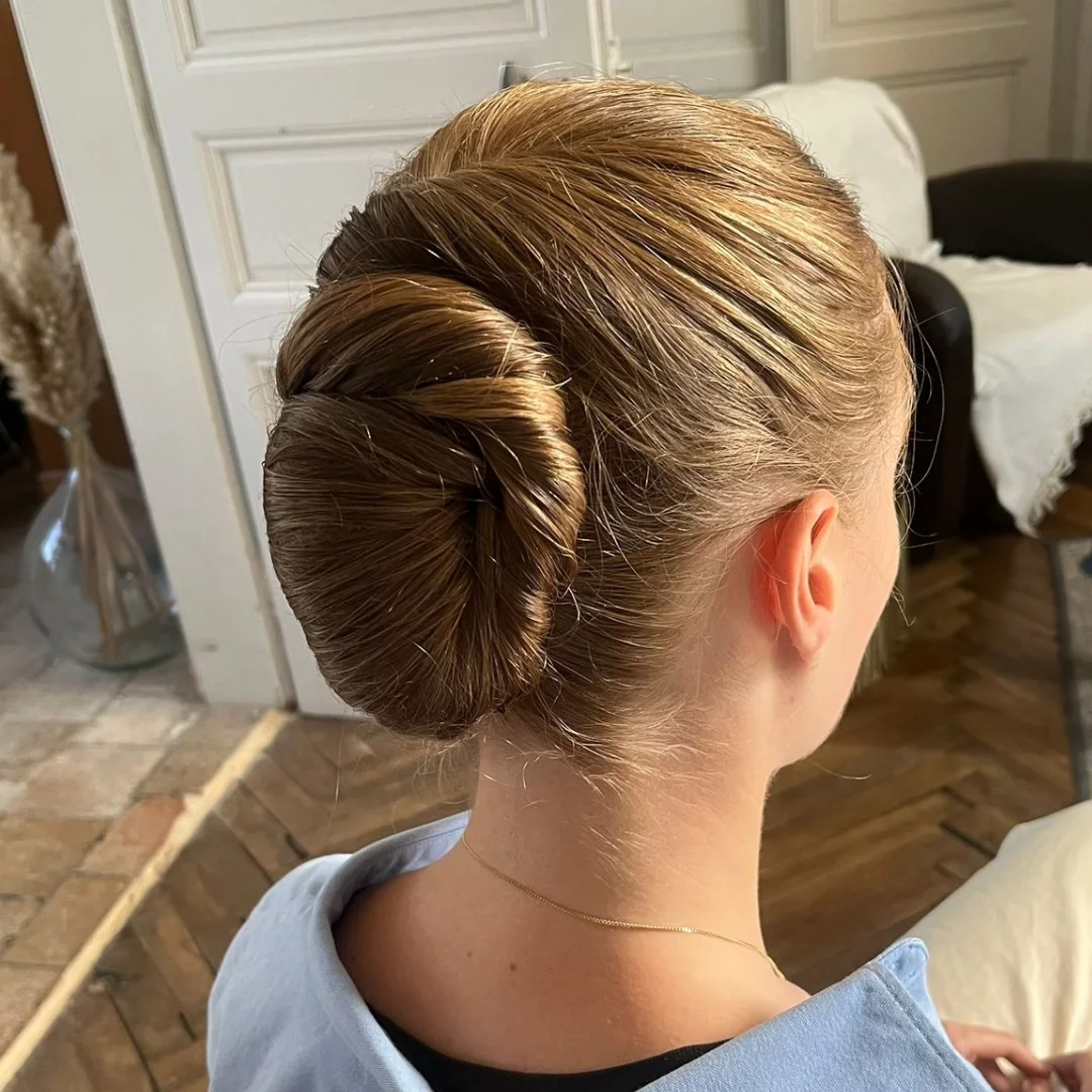 Sleek Twisted Low Bun with Polished Finish