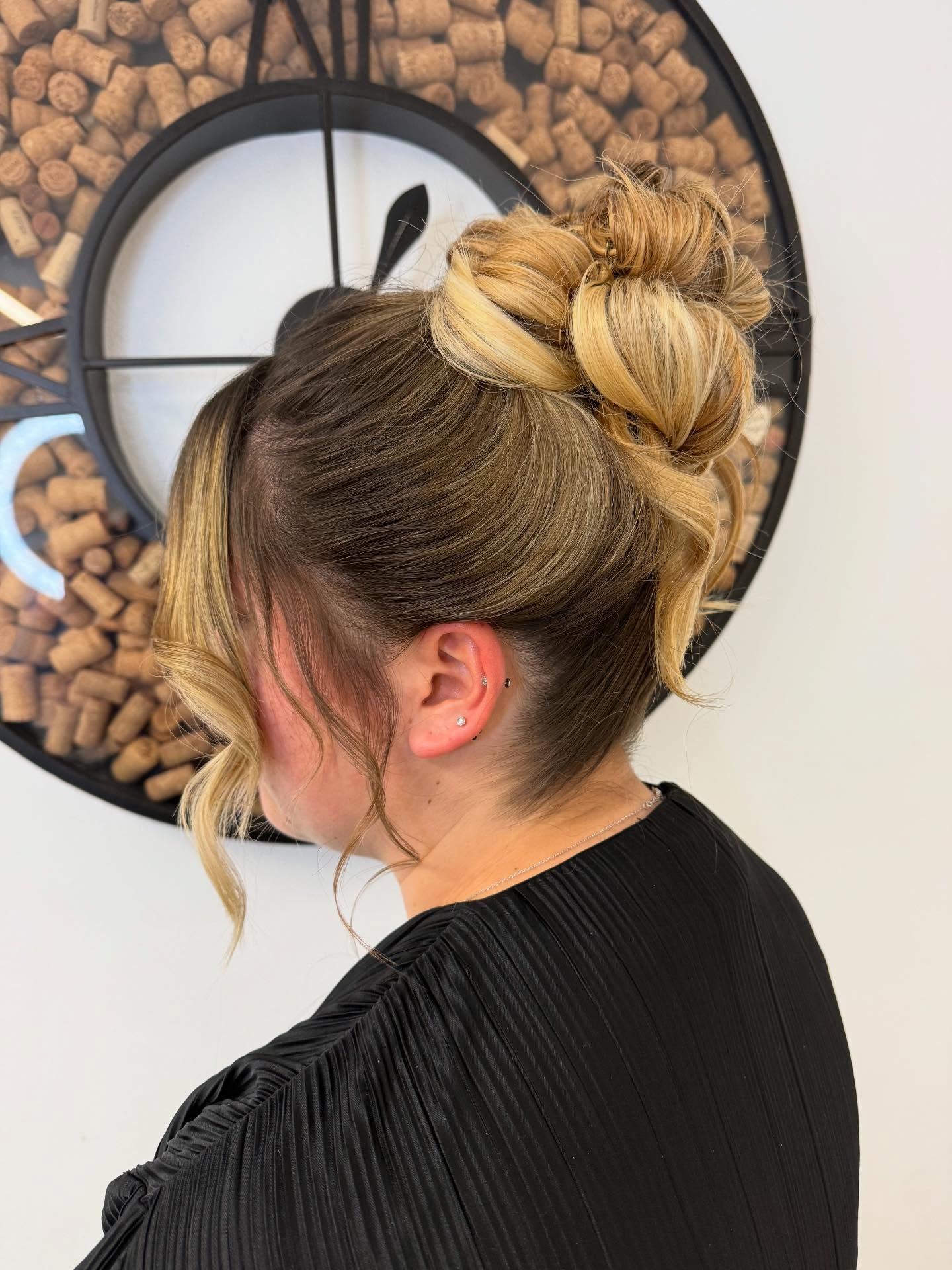 Textured High Bun with Loose Face-Framing Curls