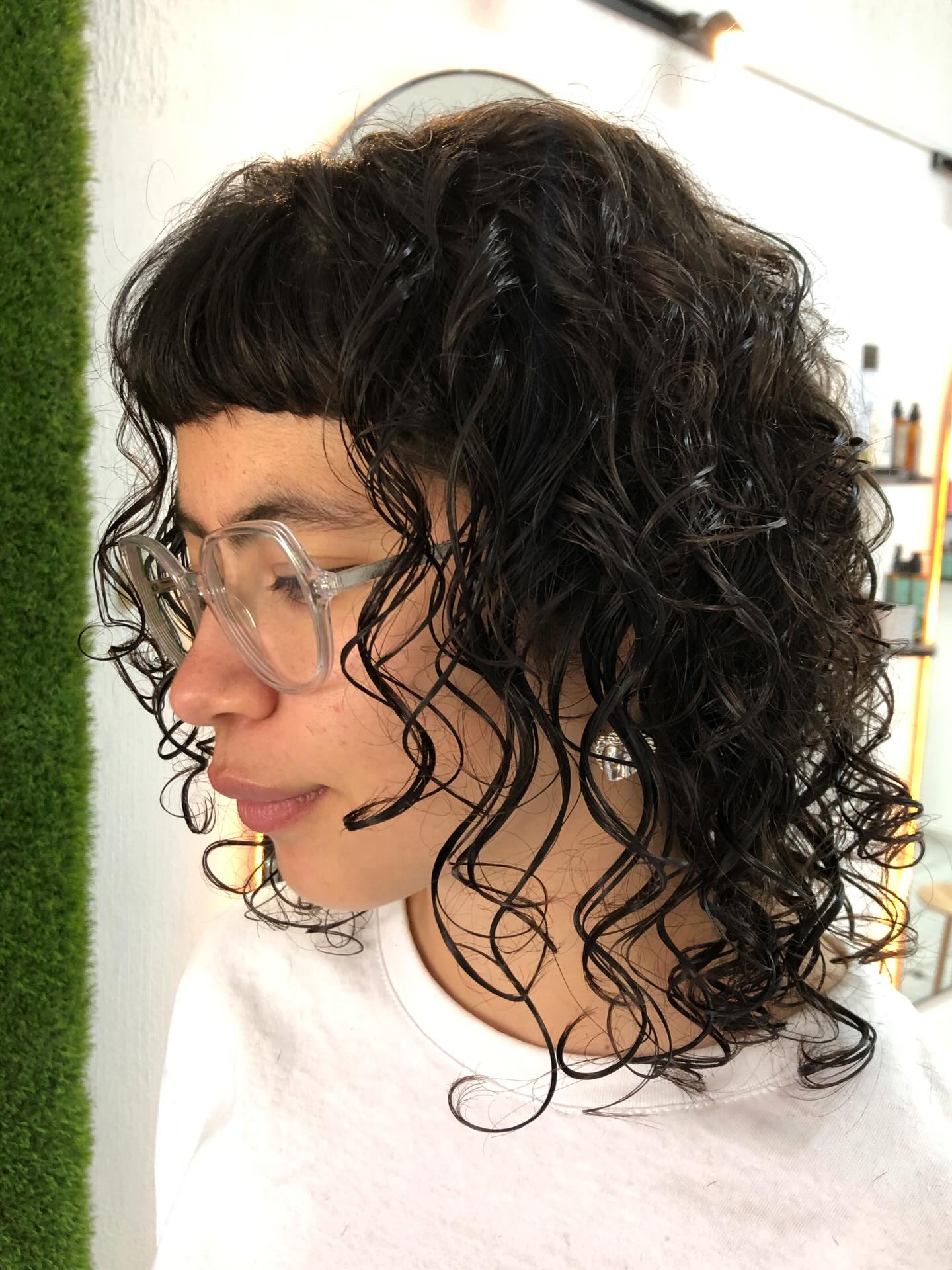 Playful Curly Cut with Soft Bangs