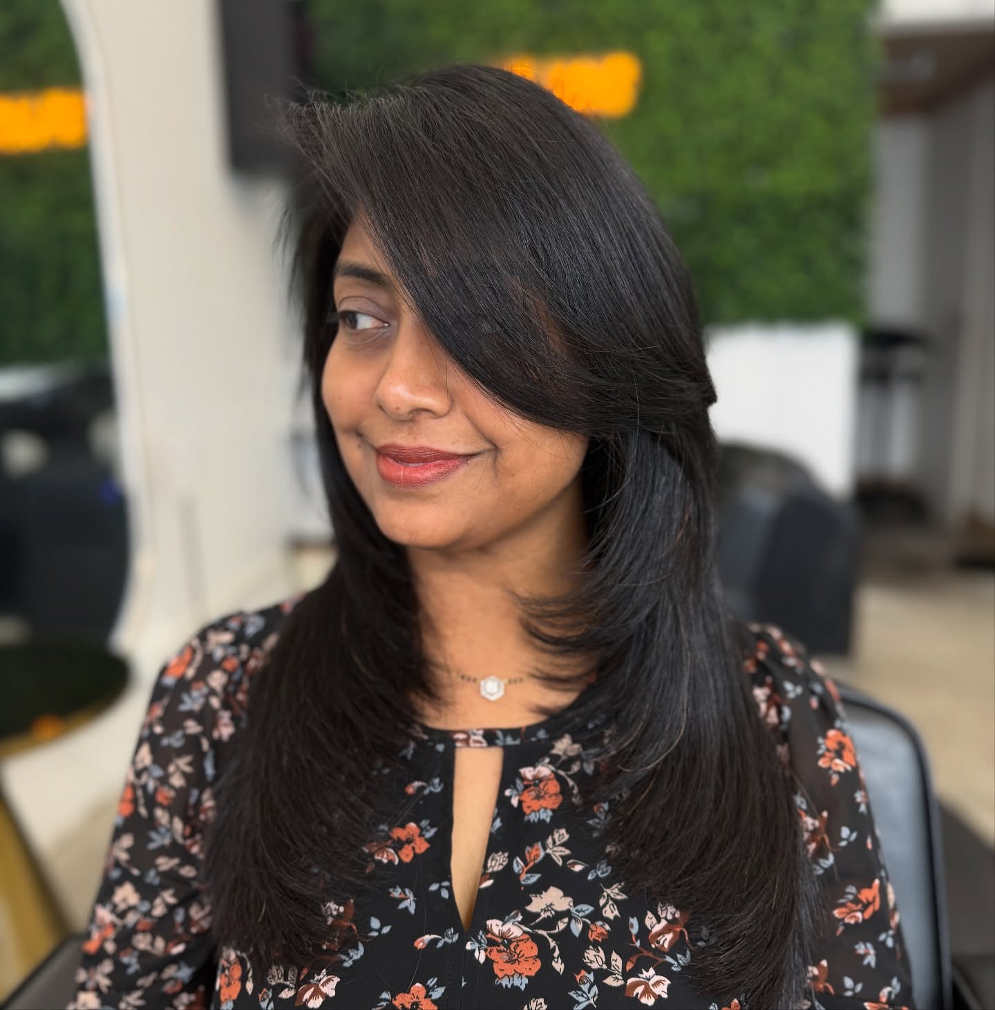 Sleek Long Layered Cut with Side-Swept Bangs