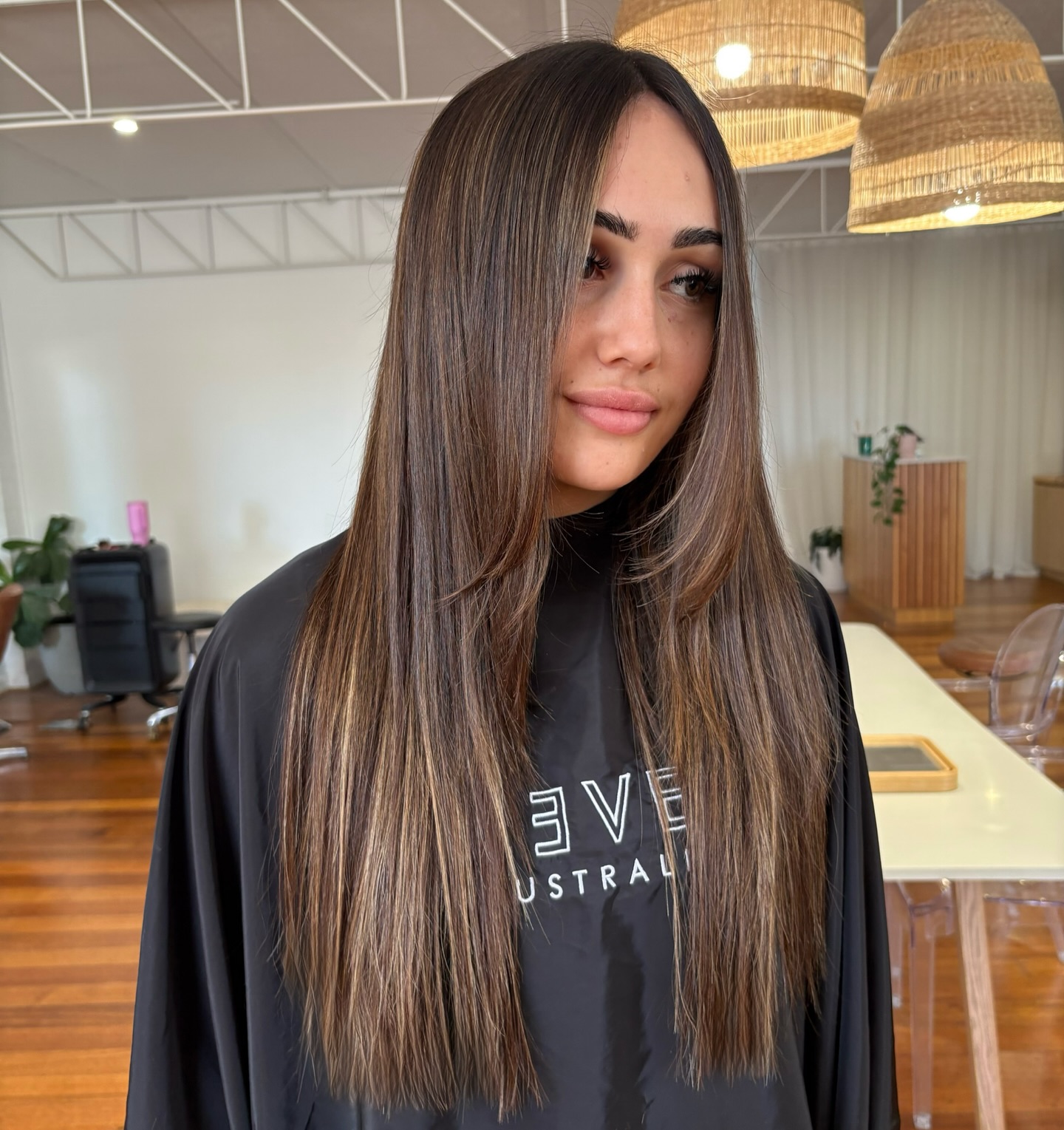 Sleek Long Straight Cut with Subtle Caramel Highlights