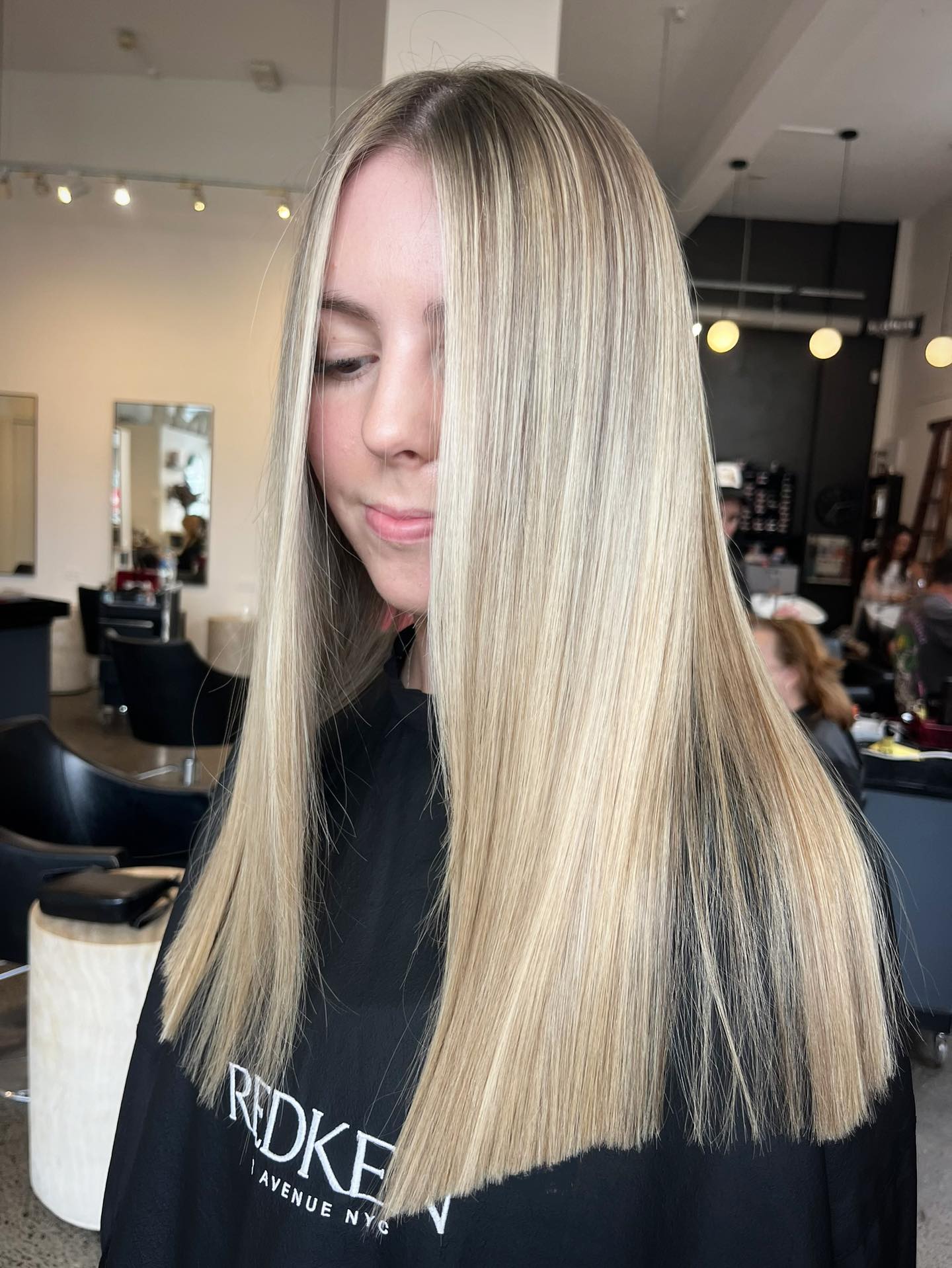 Sleek Long Straight Cut with Subtle Dark Roots