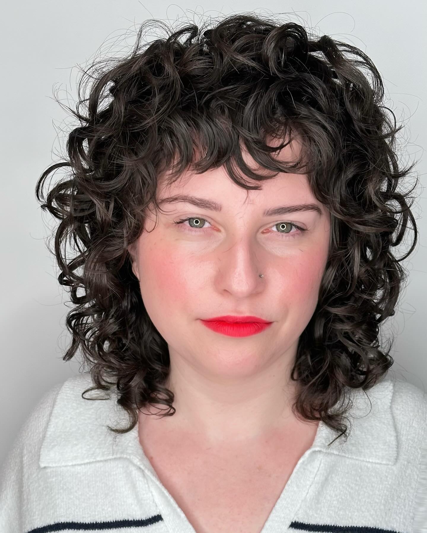 Textured Curly Cut with Chic Bangs