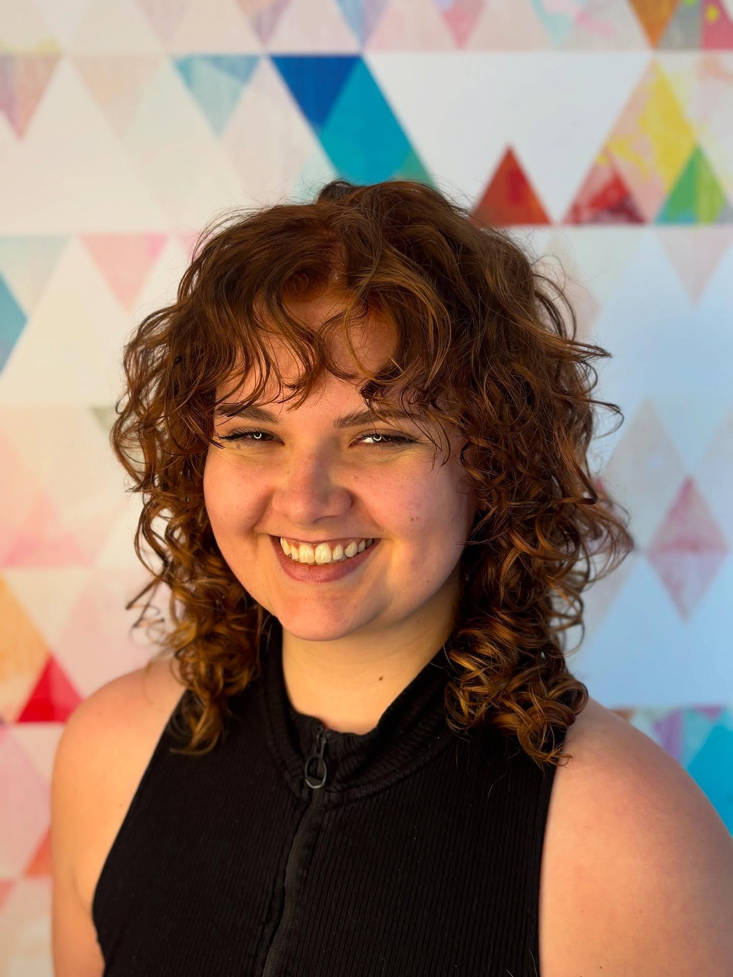 Textured Curly Mid-Length Cut with Defined Volume