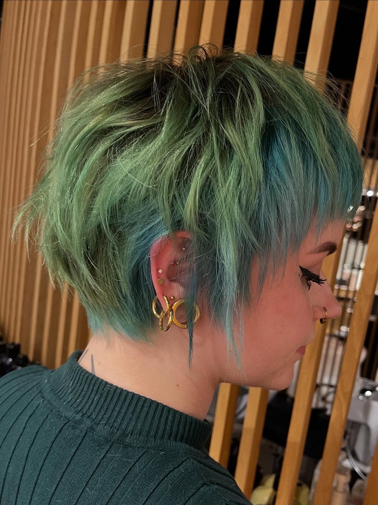 Textured Long Pixie Cut with Vibrant Green Tones