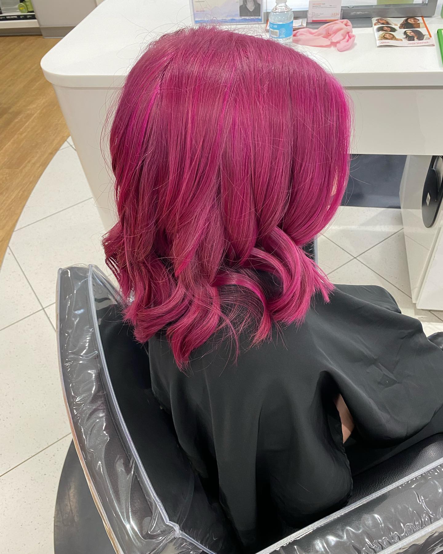 Chic Medium-Length Wavy Hot Pink Hair with Textured Layers