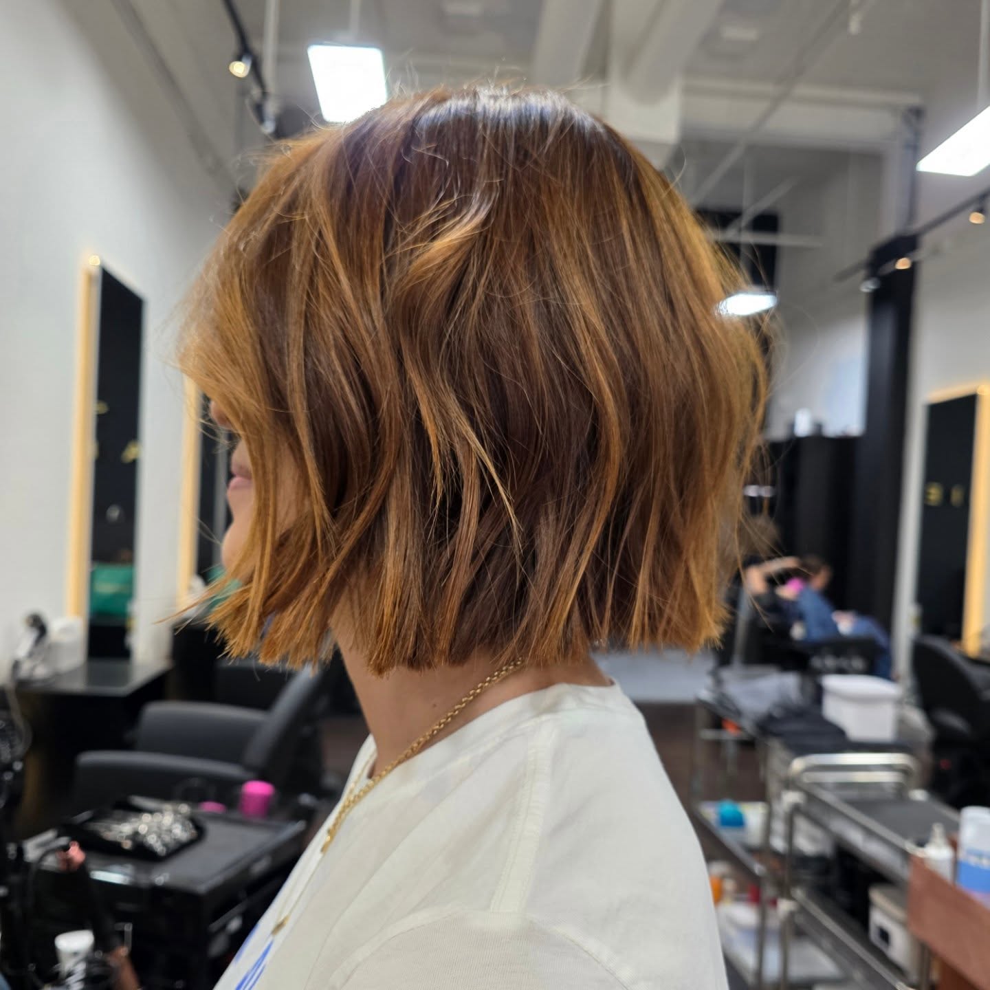 Chic Textured Bob with Warm Highlights