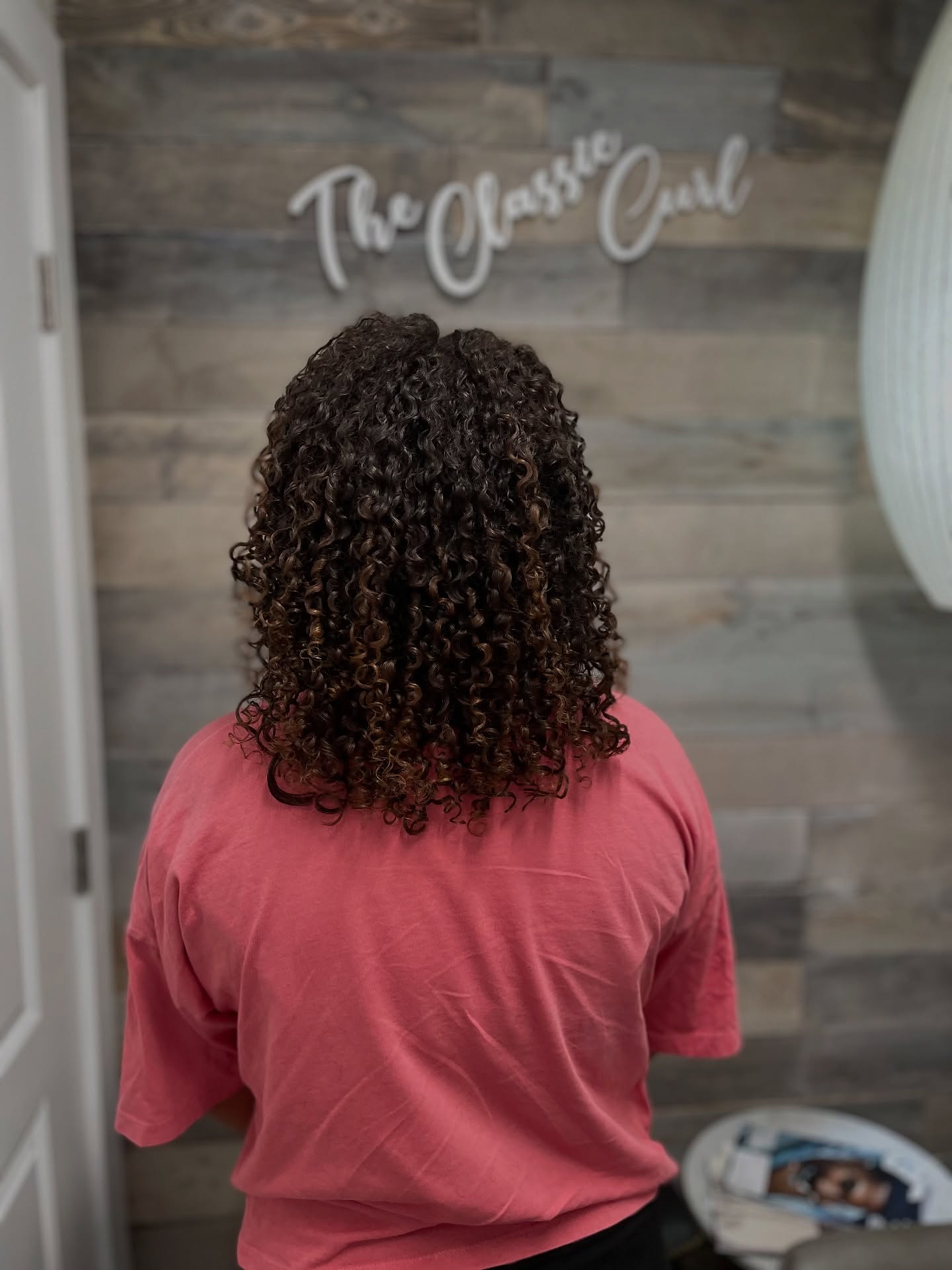 Classic Curly Shoulder-Length Cut with Defined Curls