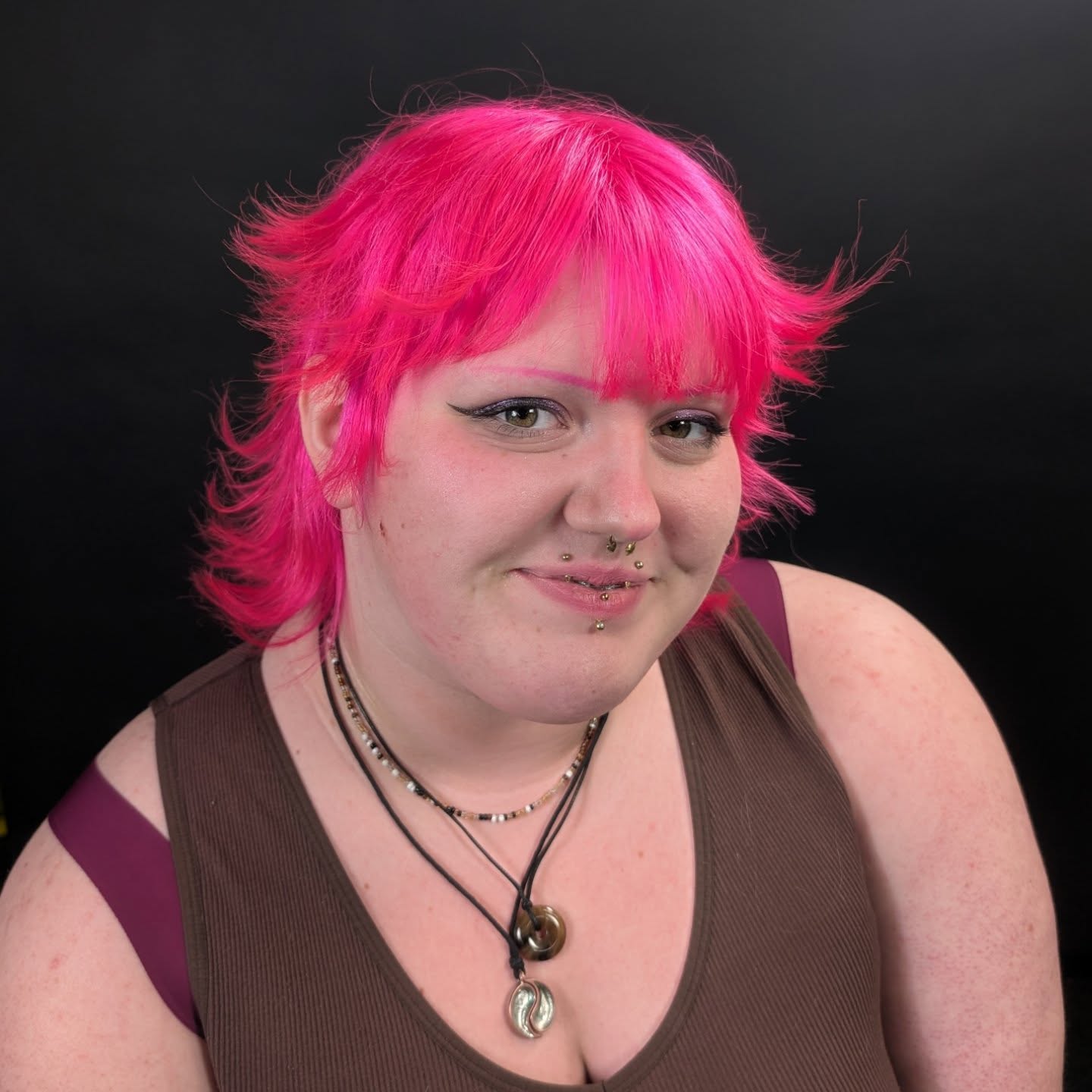 Edgy Short Layered Hot Pink Hair with Textured Bangs