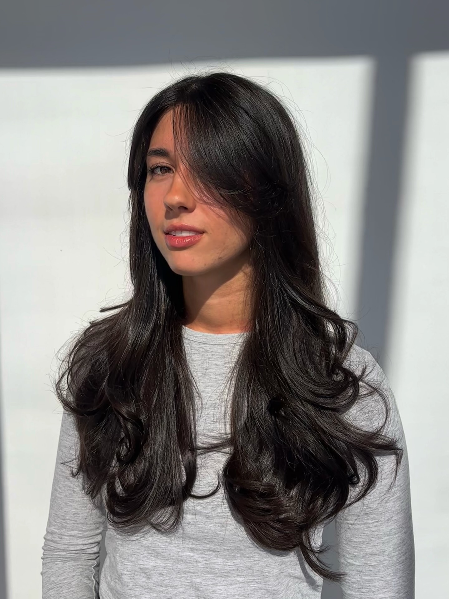 Elegant Long Layers with Face Framing Movement