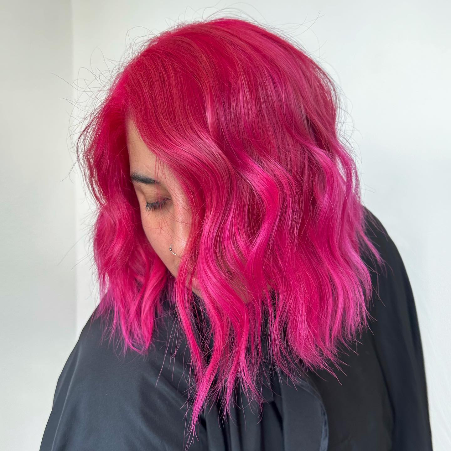 Playful Wavy Hot Pink Hair with Textured Ends
