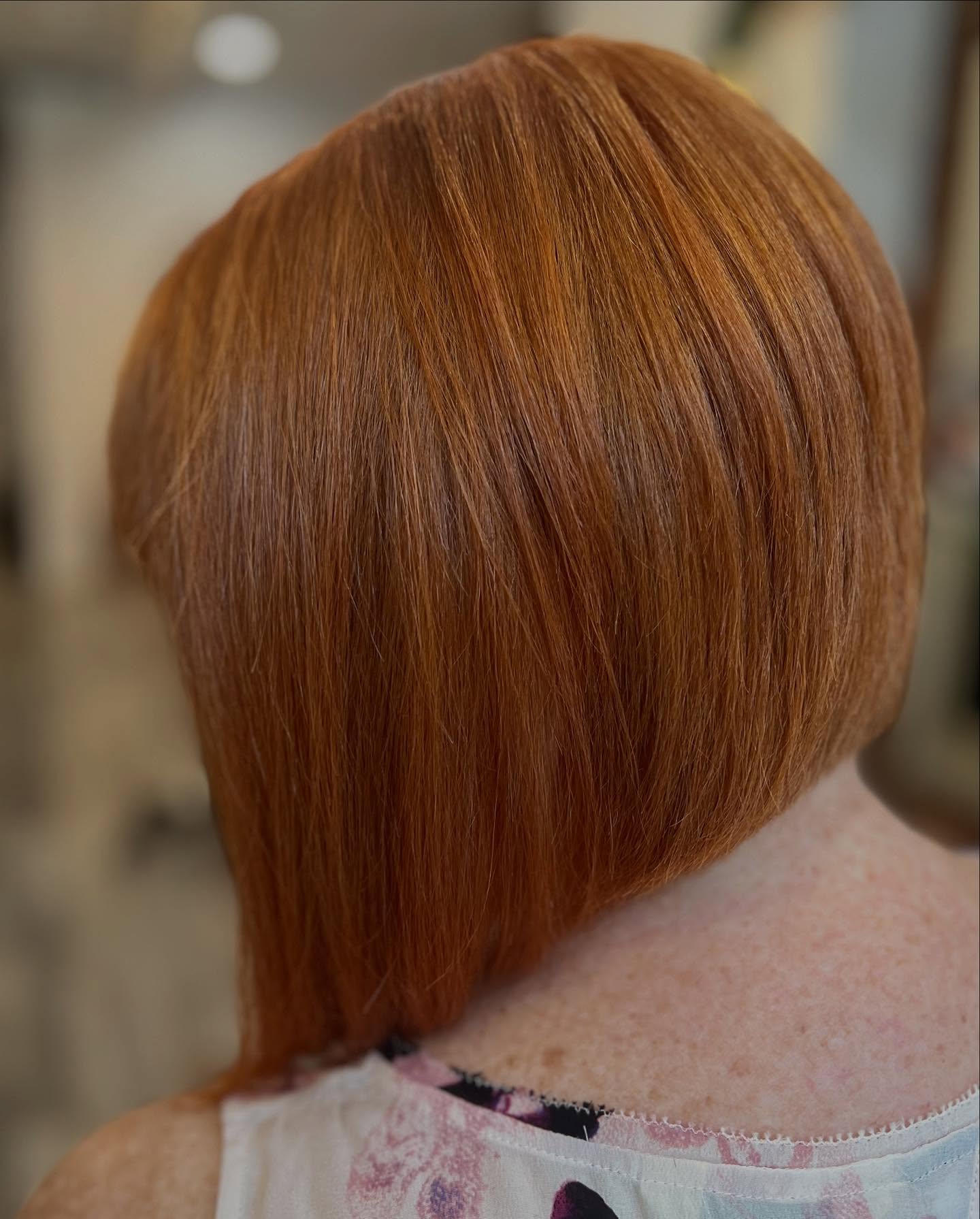 Sleek Angled Copper Bob with Subtle Texture