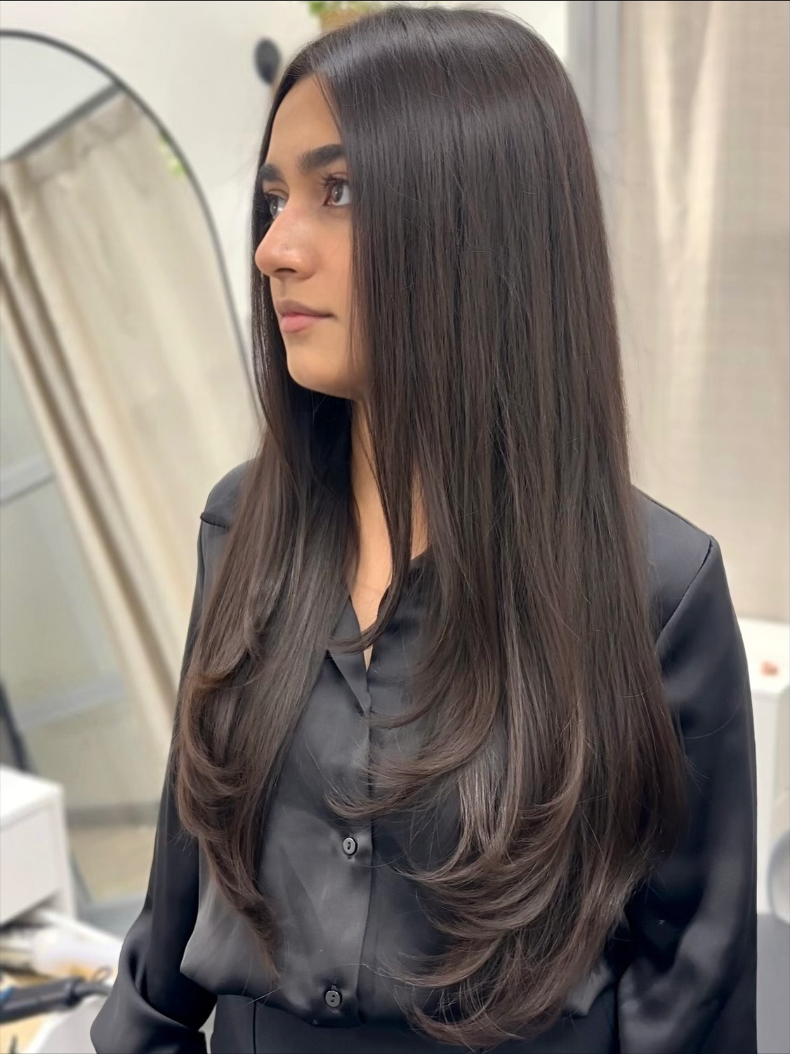 Sleek Long Layered Haircut with Face Framing