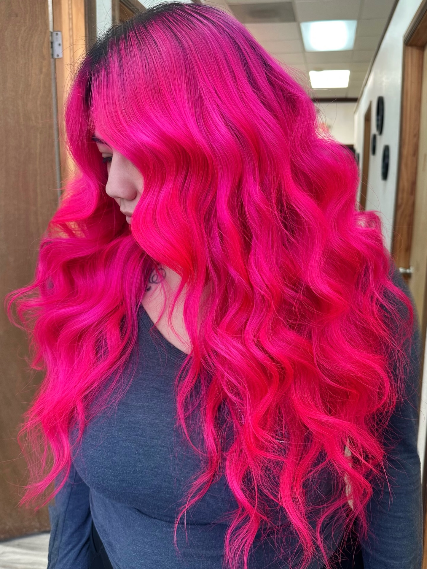 Vibrant Long Wavy Hot Pink Hair with Dark Roots