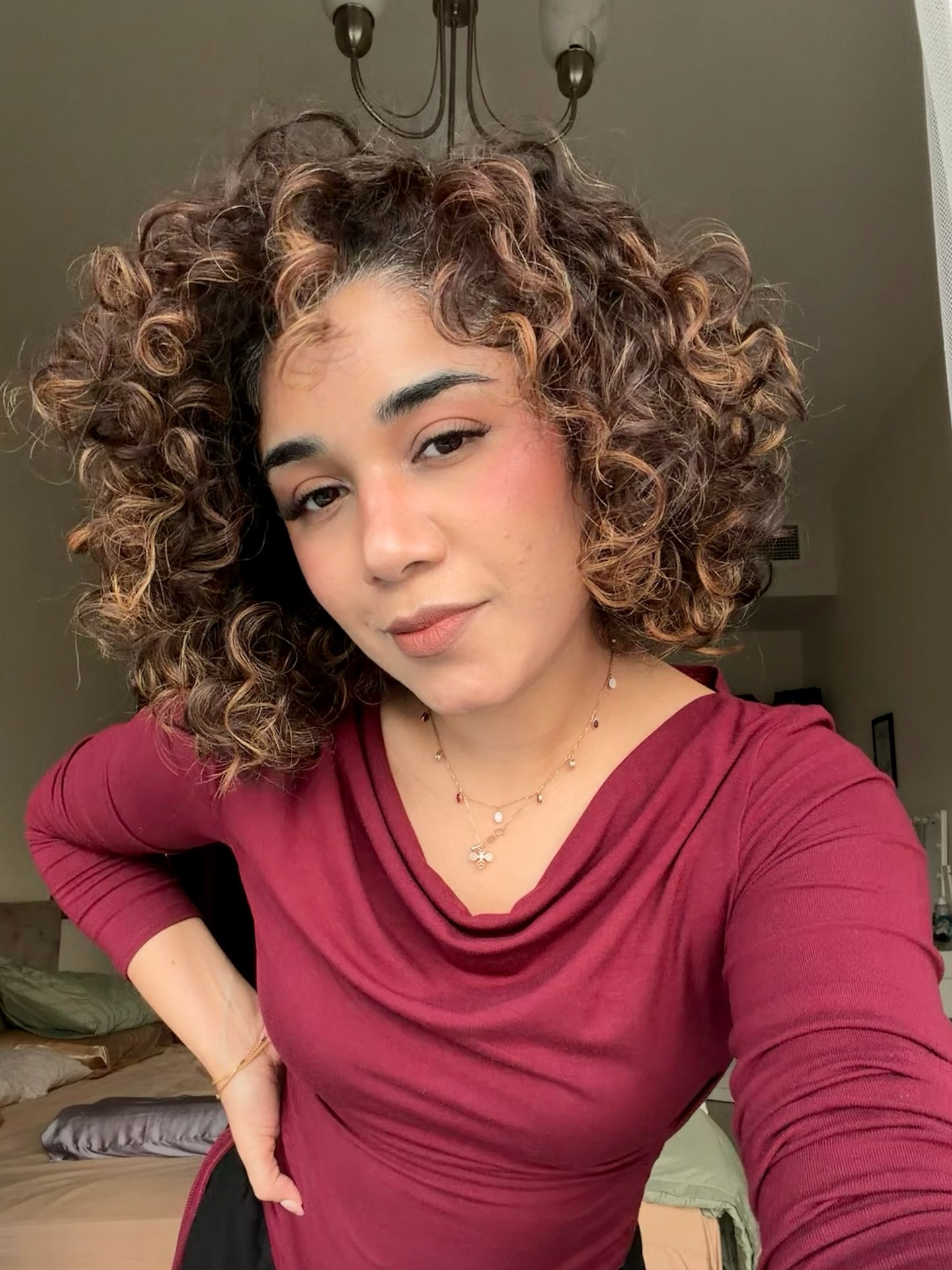 Voluminous Curly Cut with Luscious Highlights