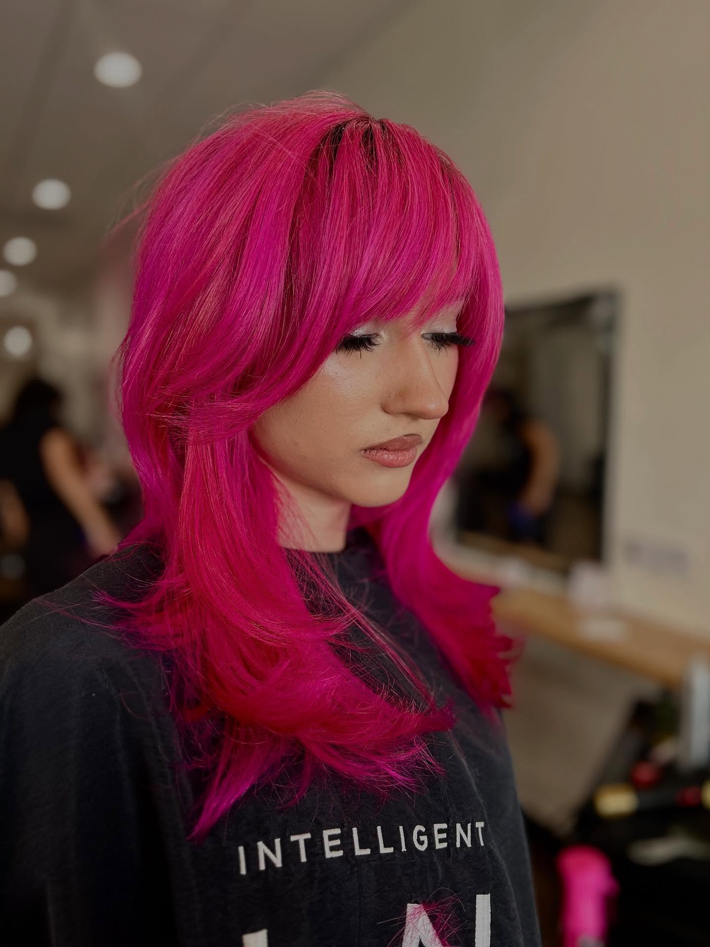 Bold Dark Pink Layered Cut with Face-Framing Bangs