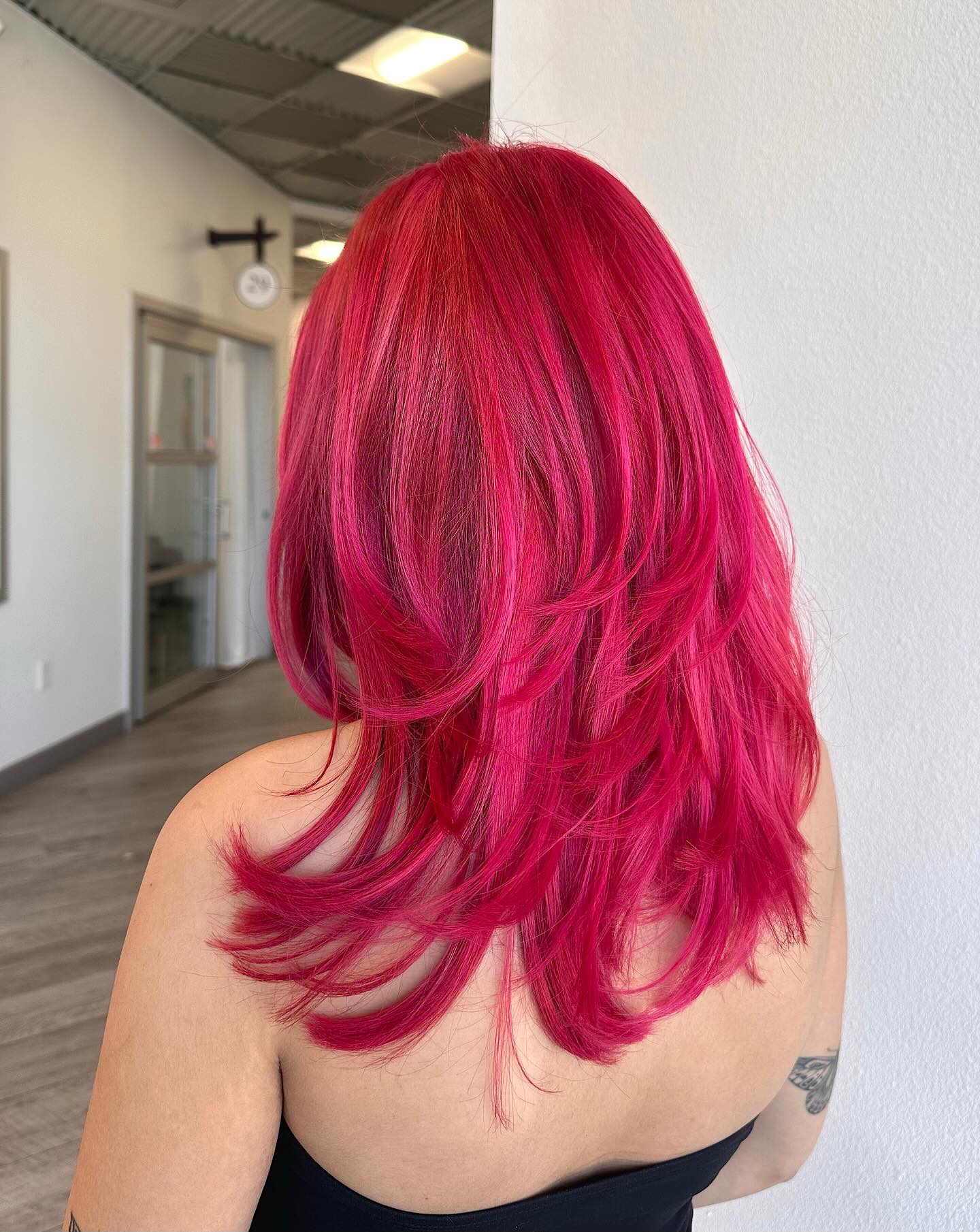 Dynamic Dark Pink Layered Hair with Flattering Movement