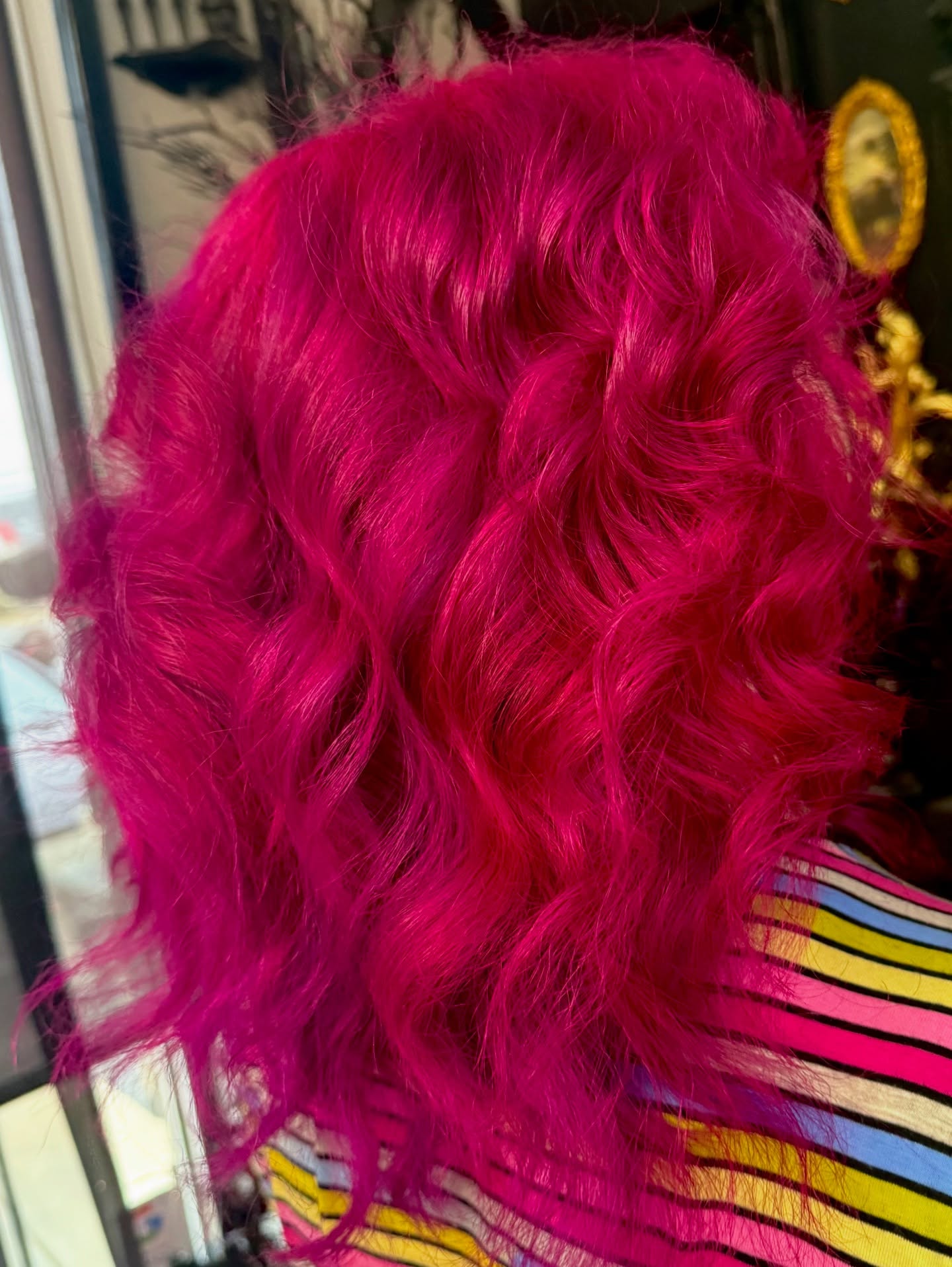 Vibrant Dark Pink Curly Shoulder-Length Cut