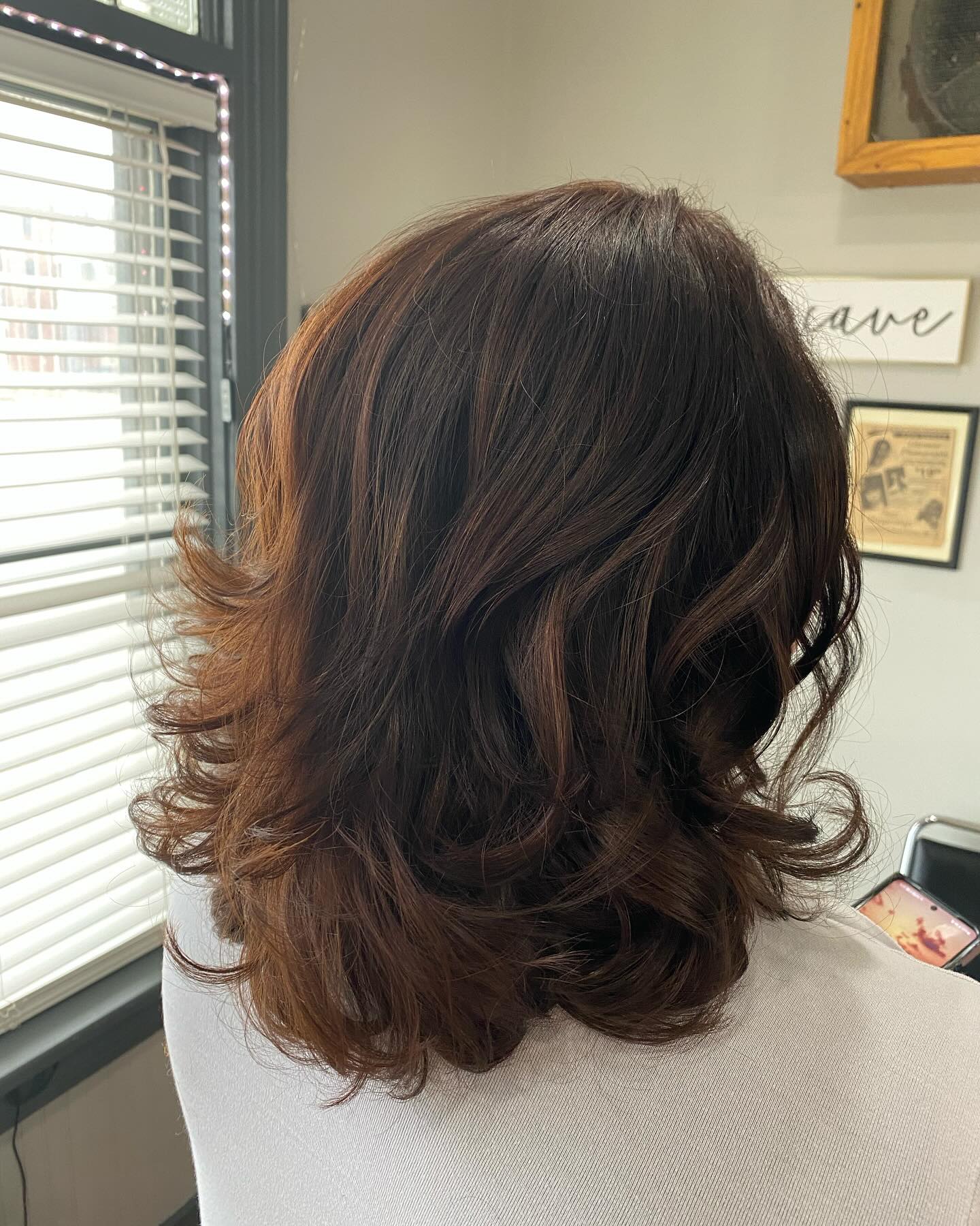 Rich Red-Toned Shoulder-Length Shag with Soft Waves