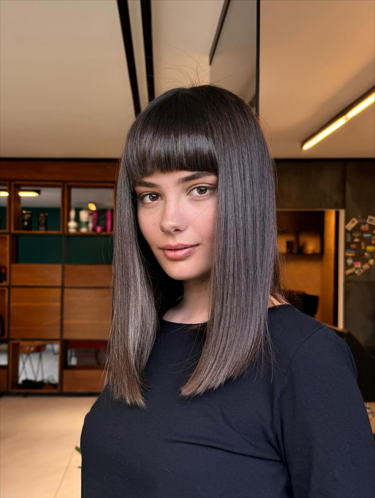 Sleek Medium-Length Cut with Bold Blunt Bangs