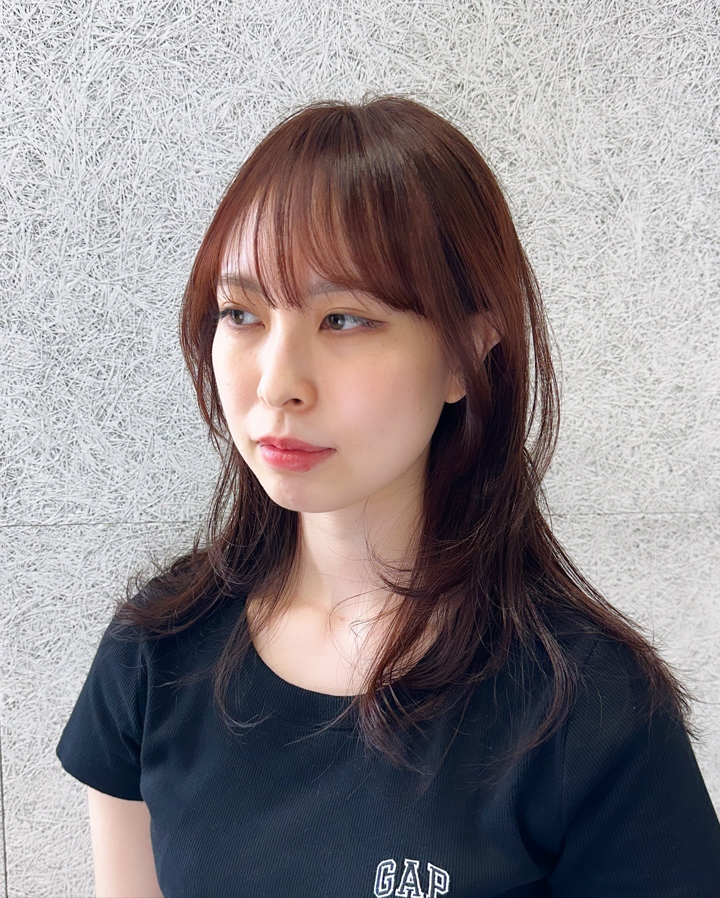 Softly Layered Medium-Length Cut with Subtle Bangs