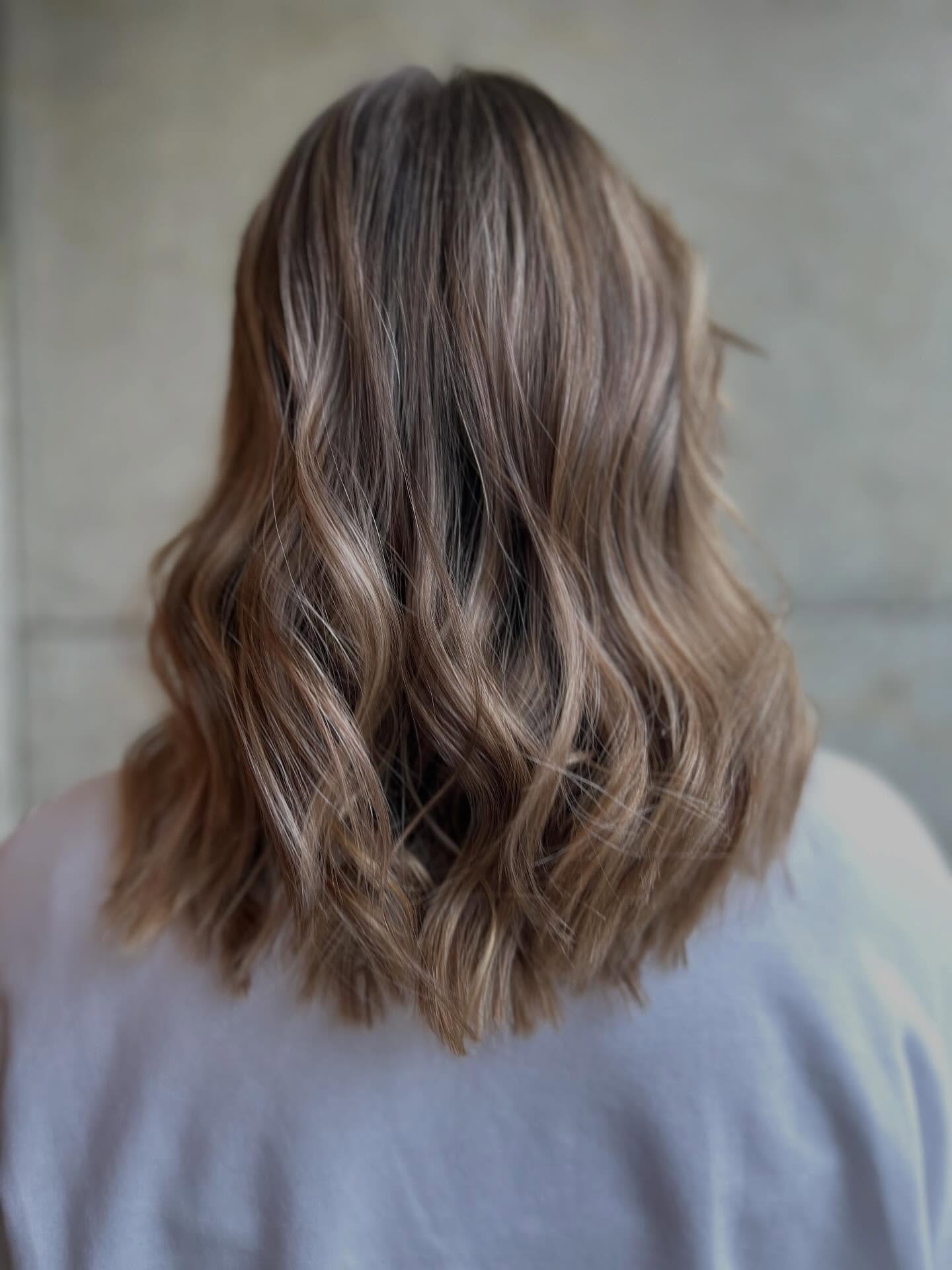 Softly Textured Medium-Length Cut with Loose Waves