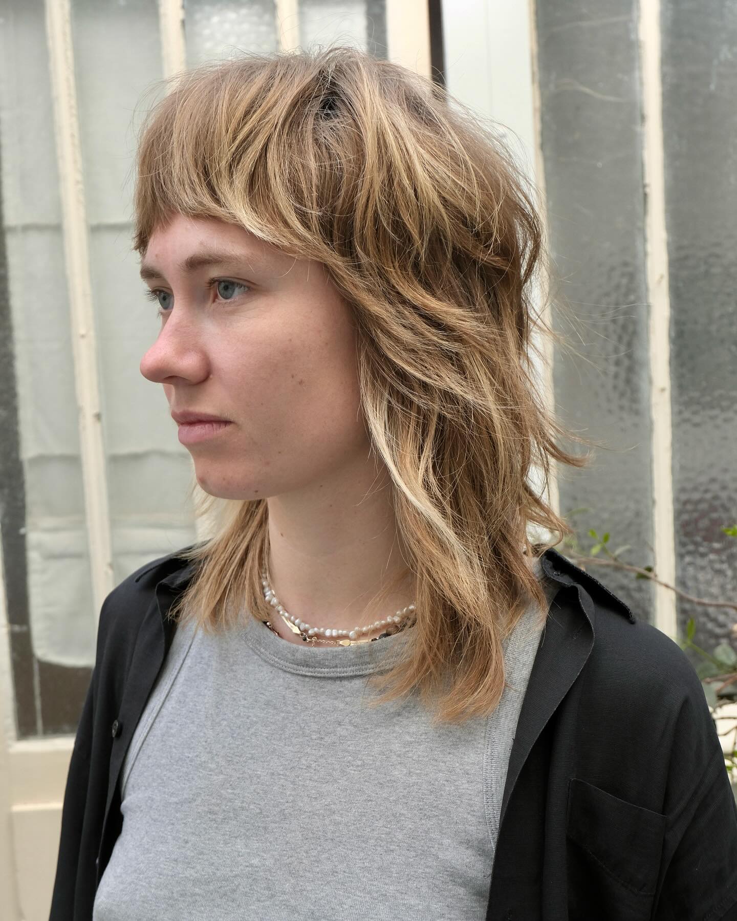 Trendy Textured Shoulder-Length Shag with Blunt Bangs