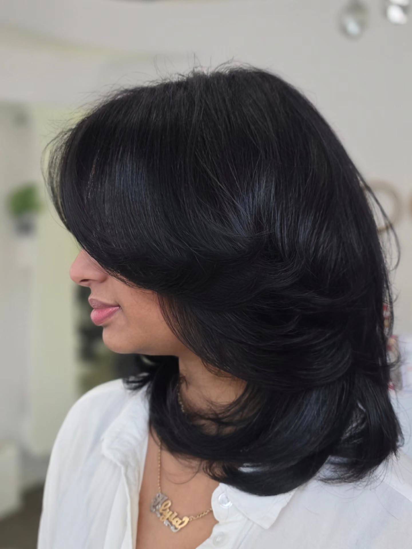 Voluminous Layered Medium-Length Cut with Soft Flicks