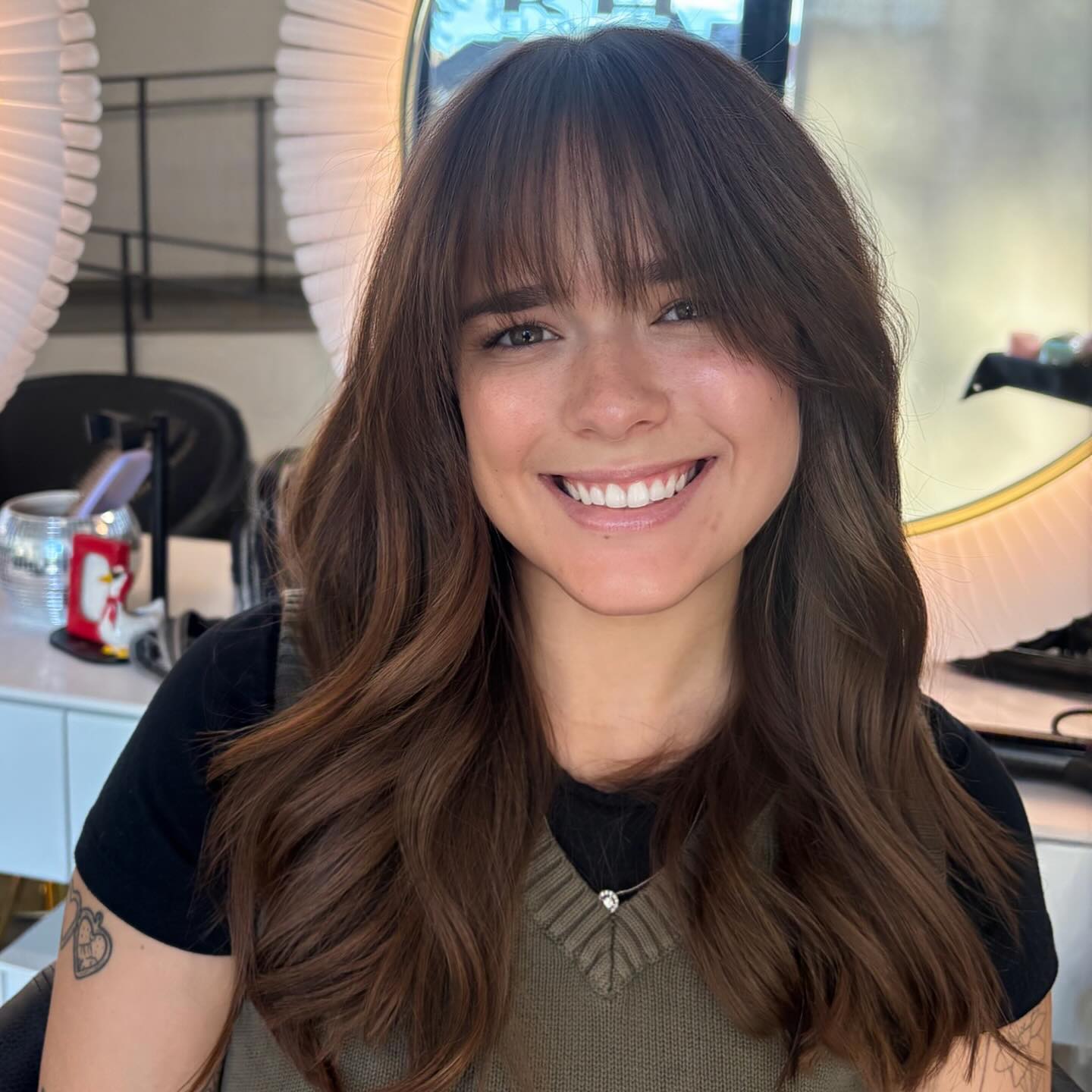 Chic Long Hair with Wispy Bangs and Soft Waves