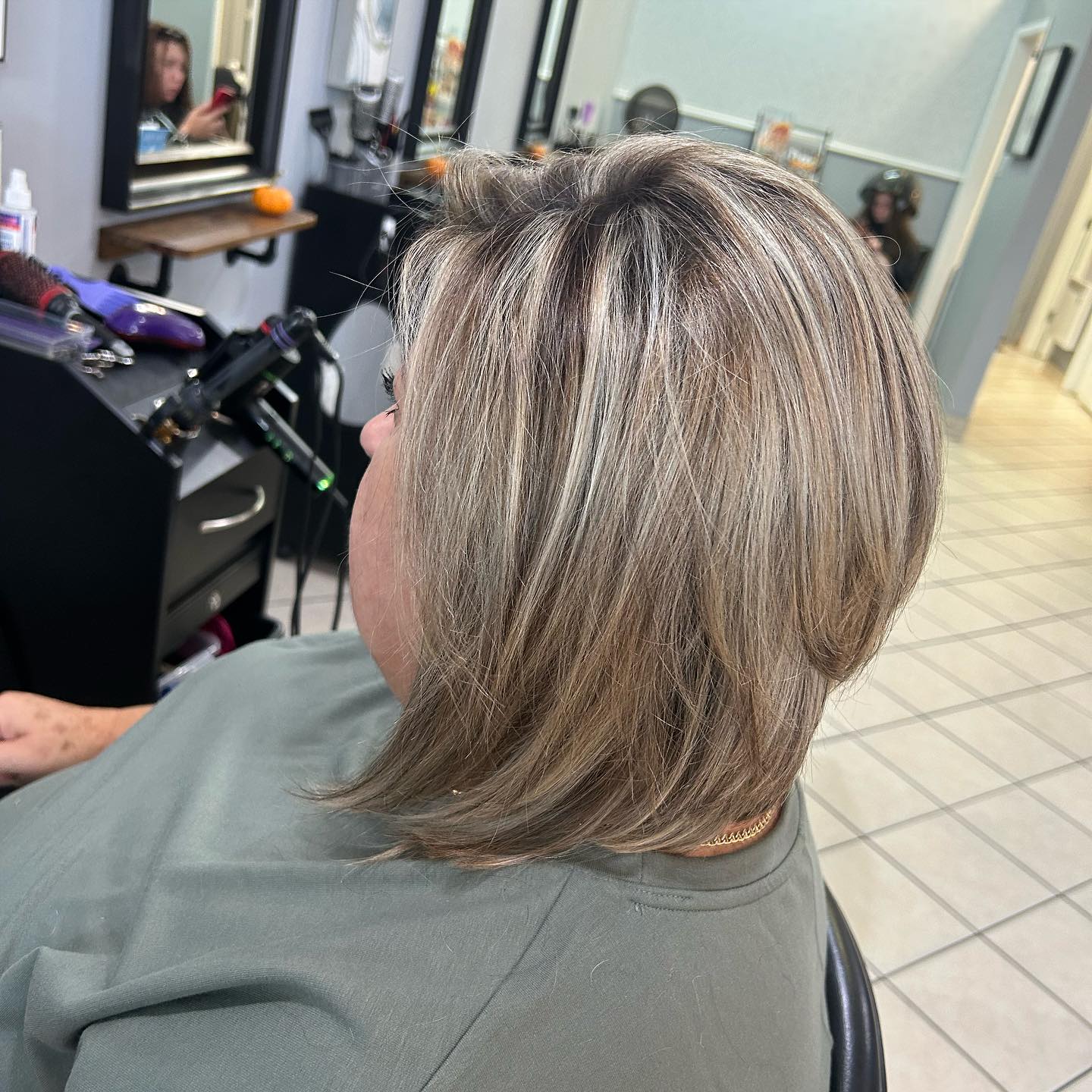 Layered Ash Blonde Bob with Subtle Dimensions