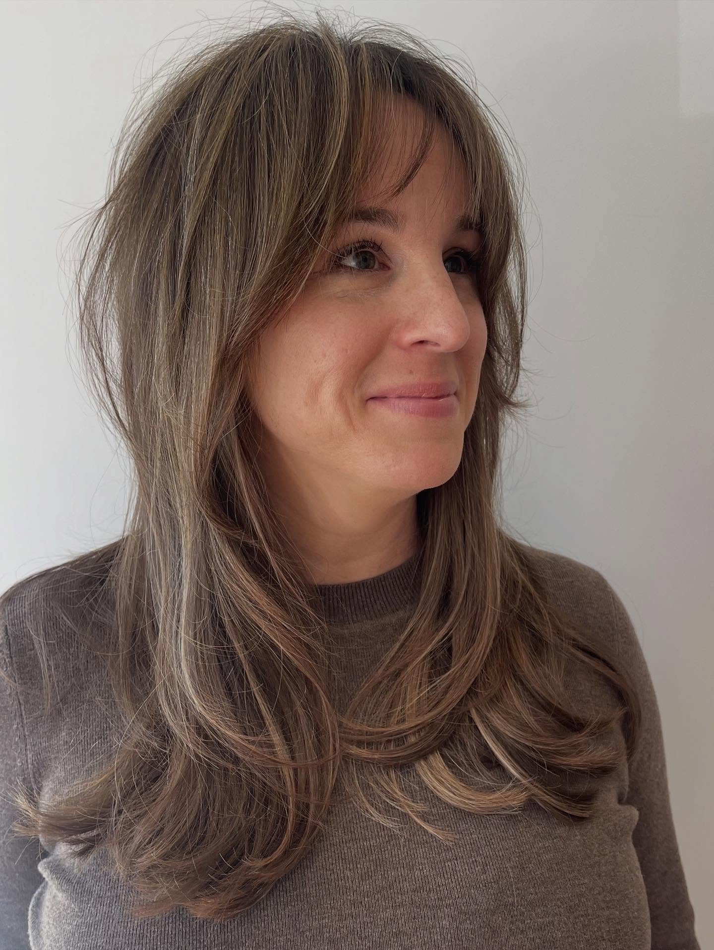 Textured Long Layers with Wispy Bangs