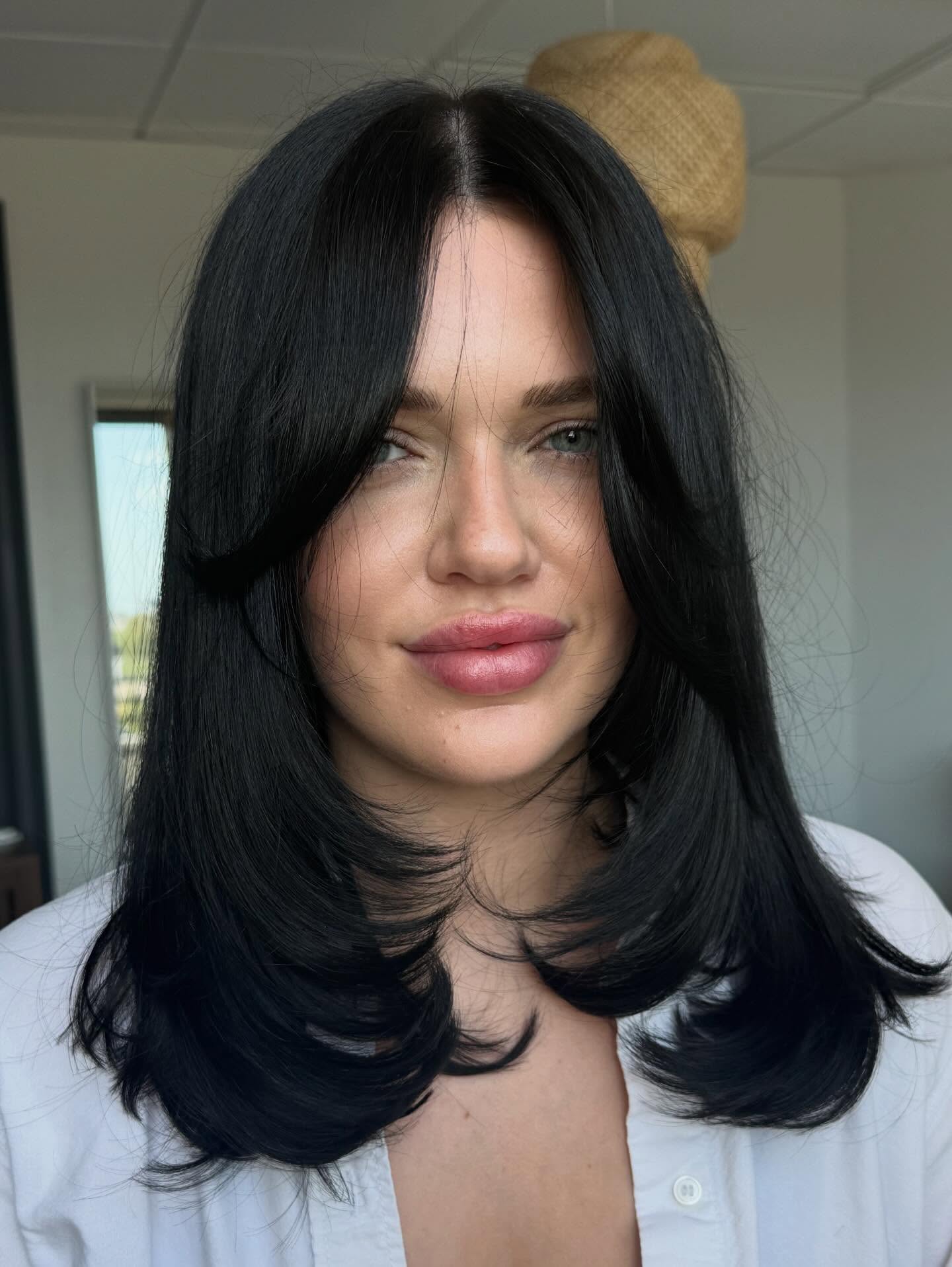 Chic Layered Cut with Face-Framing Bangs