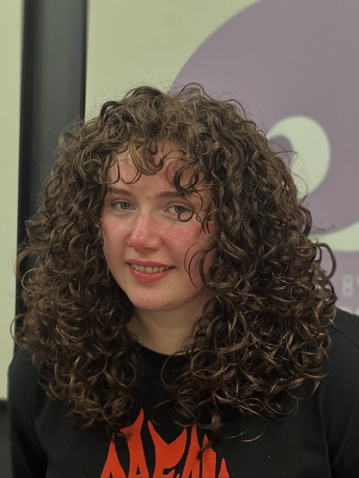 Charming Curly Mid-Length Cut with Soft Layers